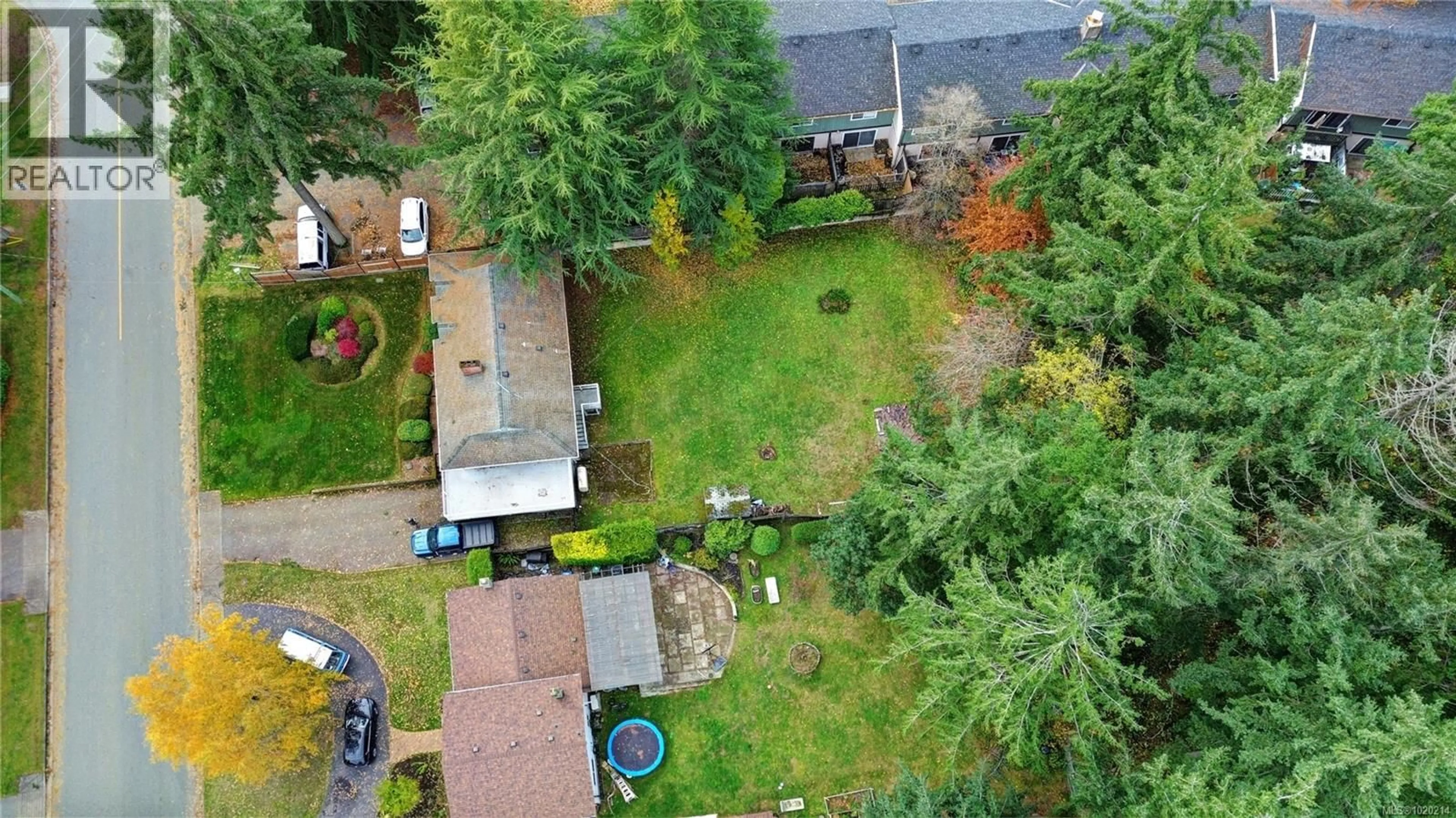 A pic from outside/outdoor area/front of a property/back of a property/a pic from drone, street for 2401 COSGROVE CRESCENT, Nanaimo British Columbia V9S3N9
