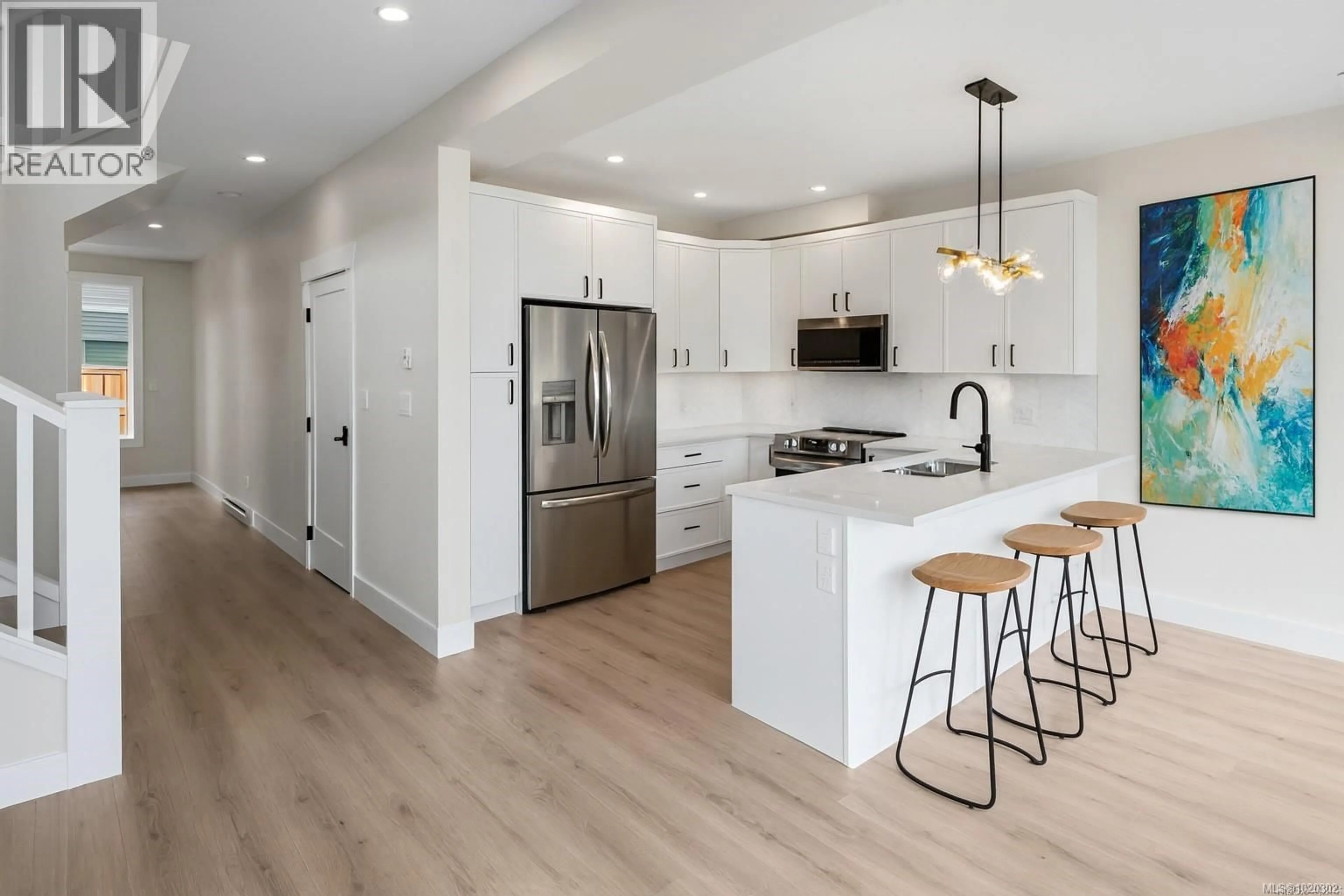 Open concept kitchen, wood/laminate floor for A - 6521 NOBLEWOOD PLACE, Sooke British Columbia V9Z0W3