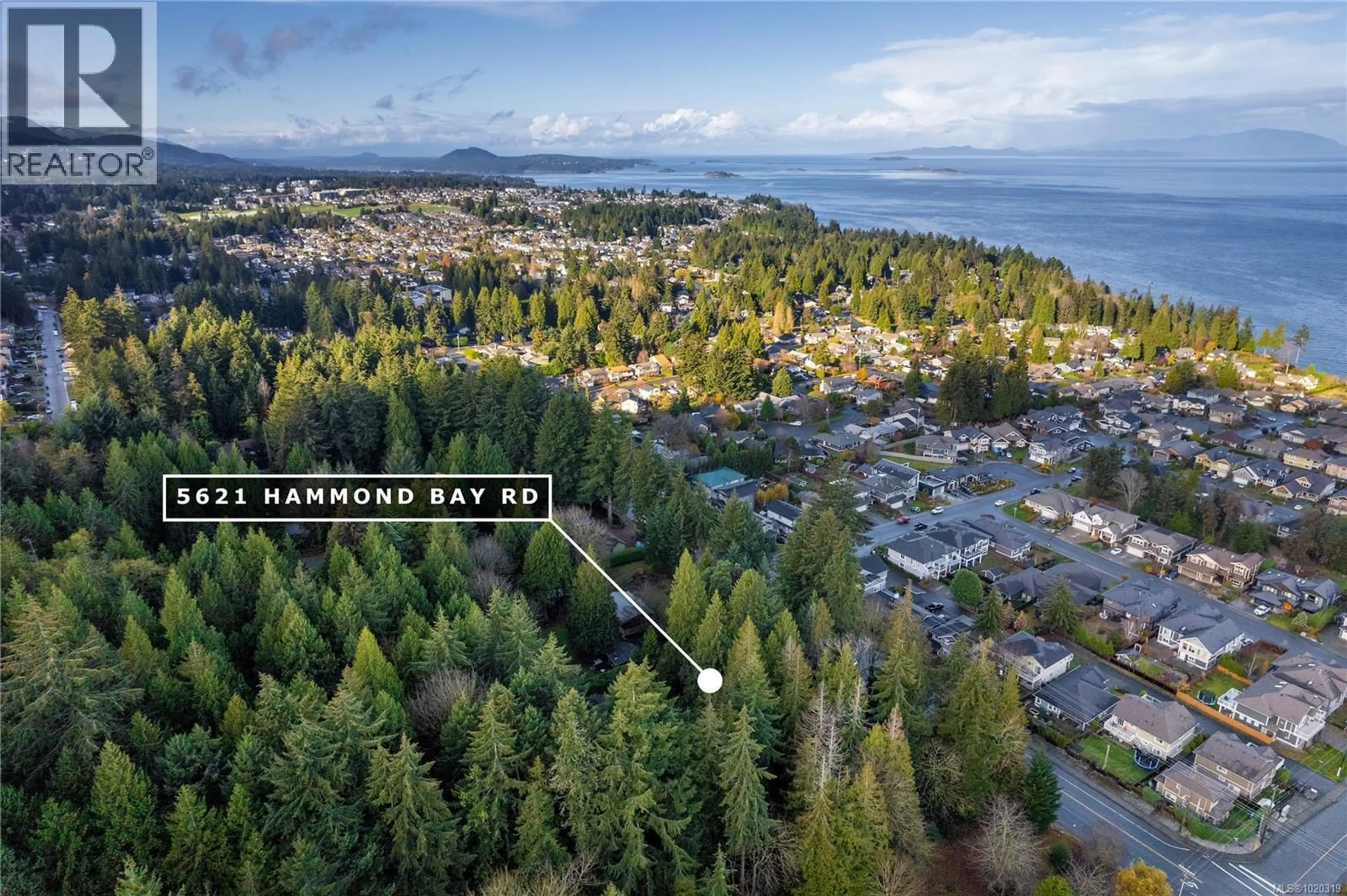 A pic from outside/outdoor area/front of a property/back of a property/a pic from drone, water/lake/river/ocean view for 5621 HAMMOND BAY ROAD, Nanaimo British Columbia V9T5N2