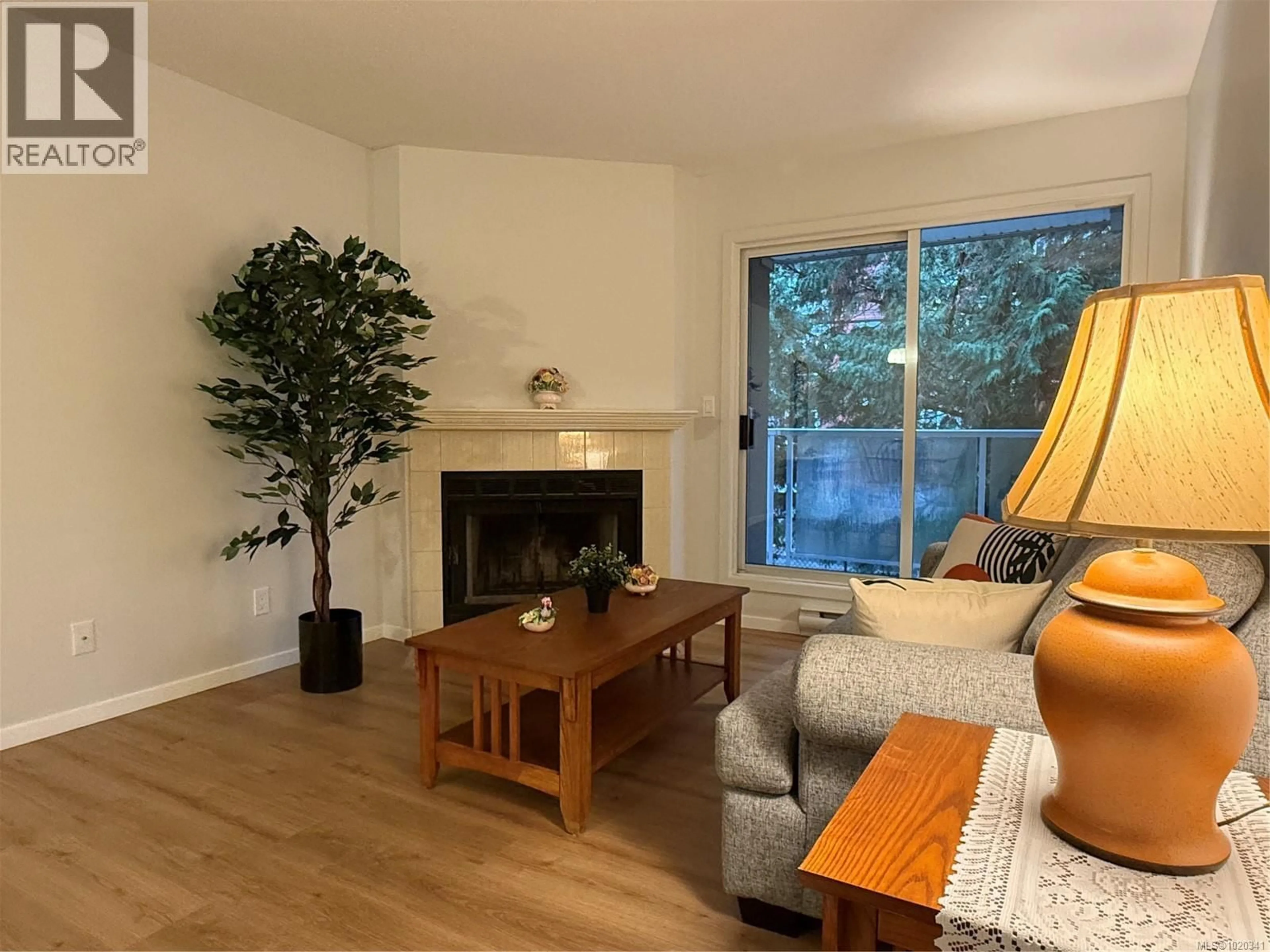 Living room with furniture, wood/laminate floor for 204 - 2520 WARK STREET, Victoria British Columbia V8T5G8
