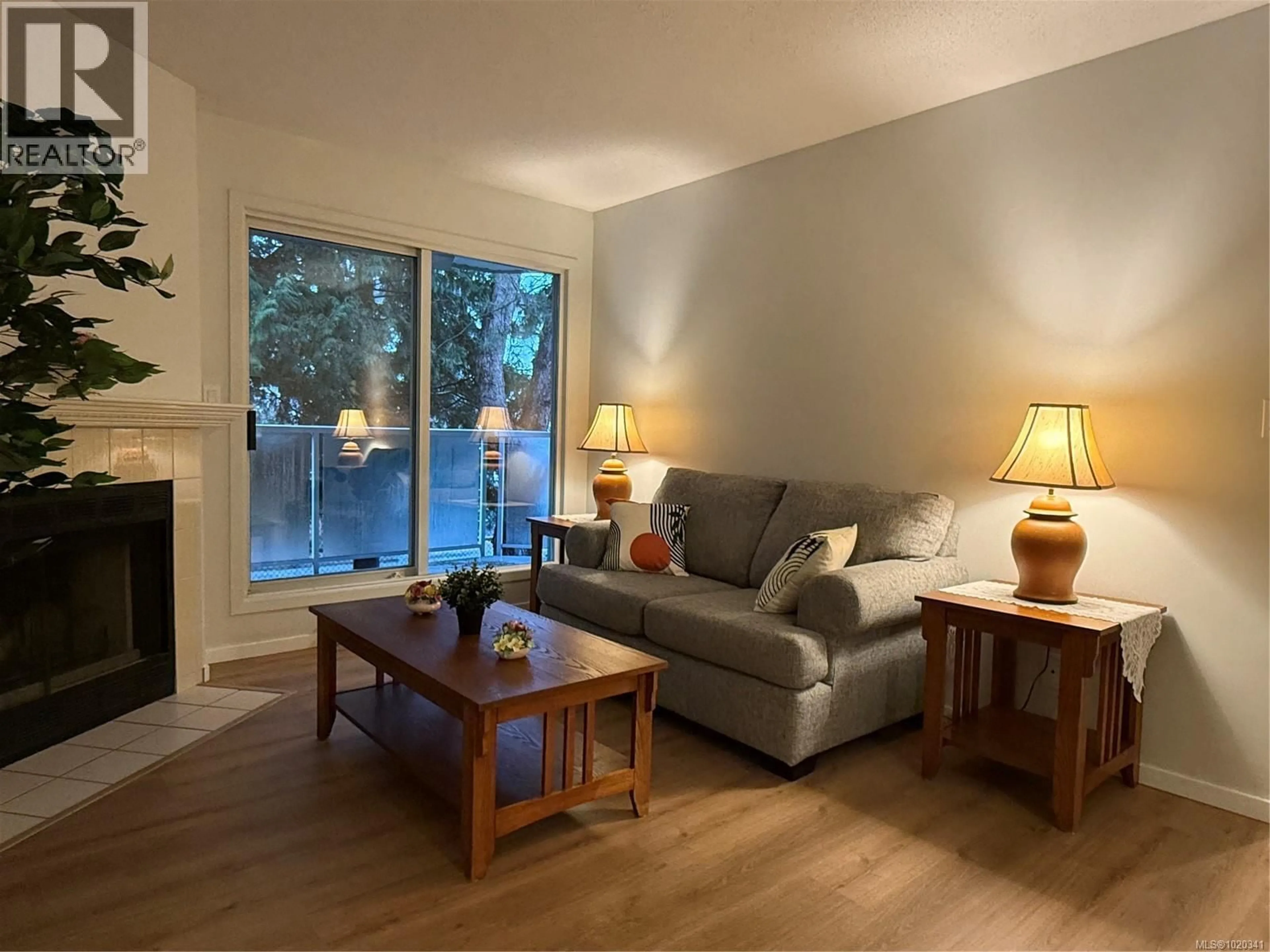 Living room with furniture, wood/laminate floor for 204 - 2520 WARK STREET, Victoria British Columbia V8T5G8