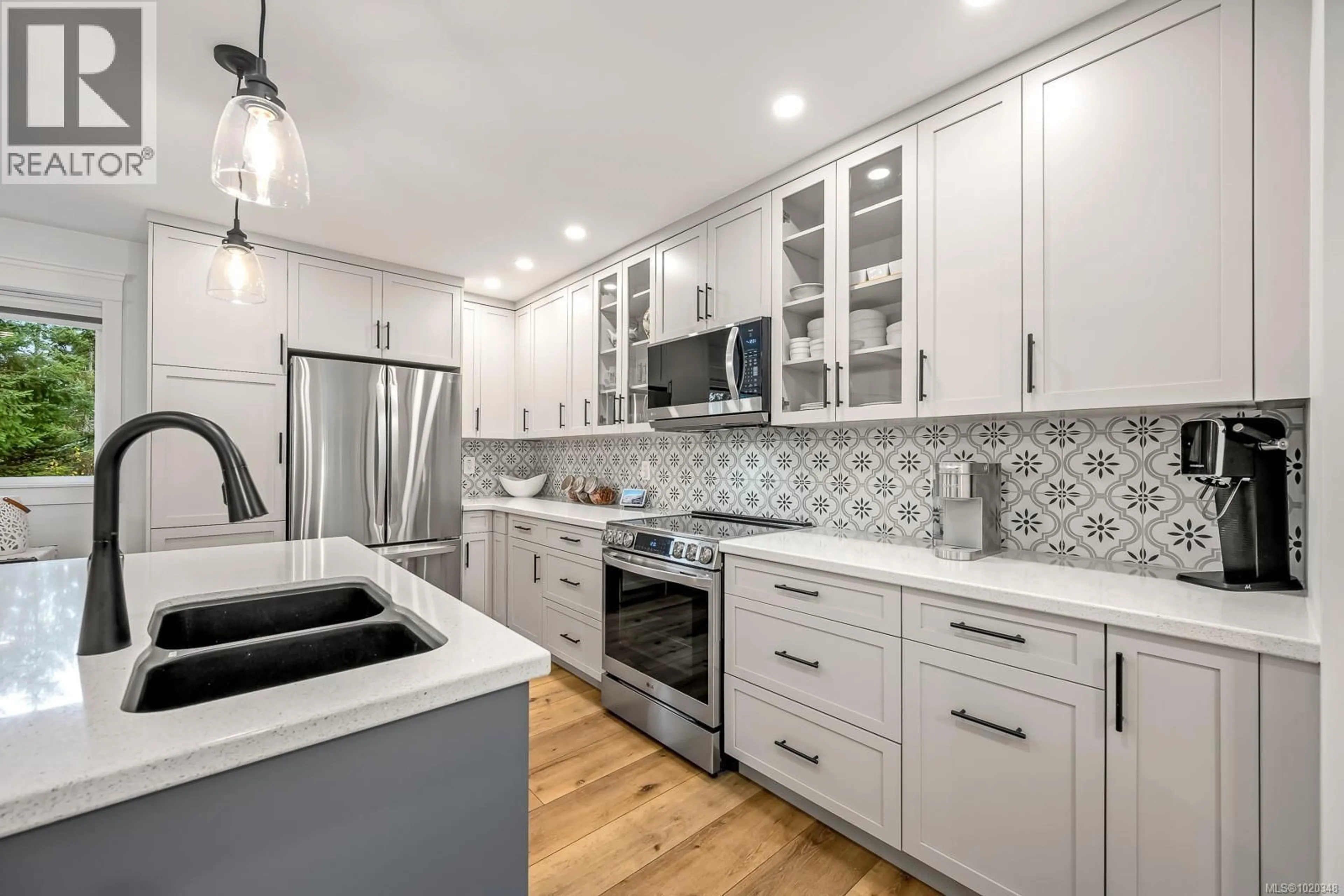 Open concept kitchen, ceramic/tile floor for 6508 MYSTERY BEACH ROAD, Fanny Bay British Columbia V0R1W0