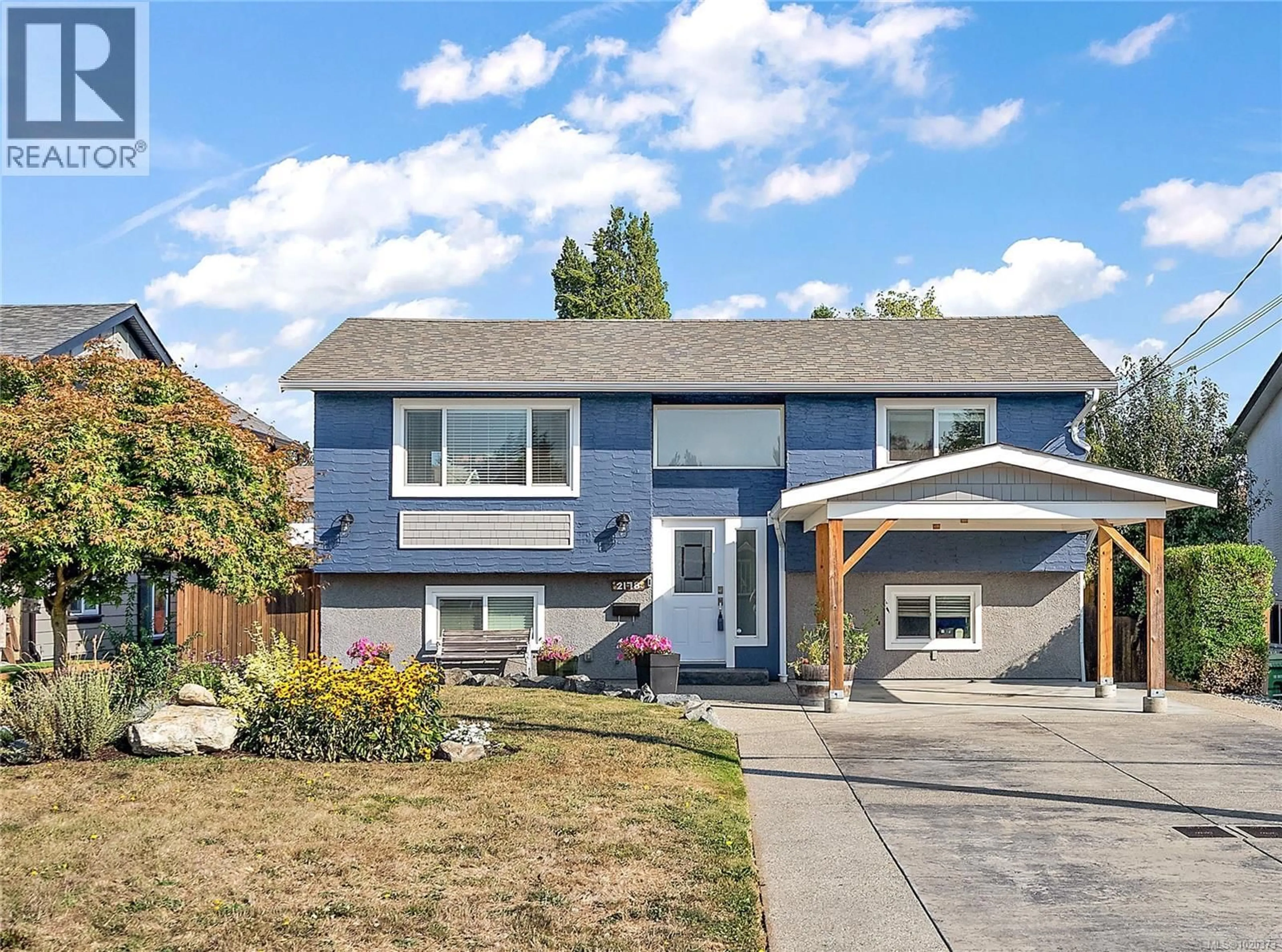 Home with vinyl exterior material, street for 2178 MILLS ROAD, Sidney British Columbia V8L2C1