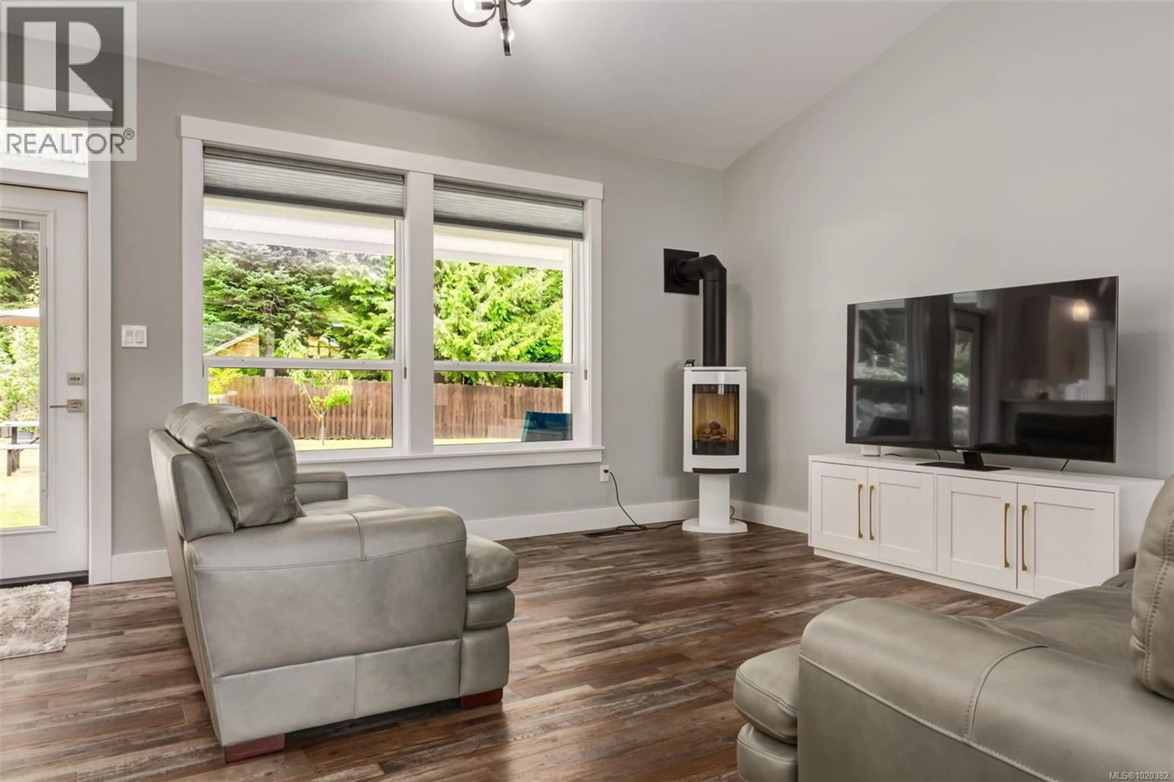 Living room with furniture, wood/laminate floor for 108 ALLVIEW LANE, Bowser British Columbia V0R1G0
