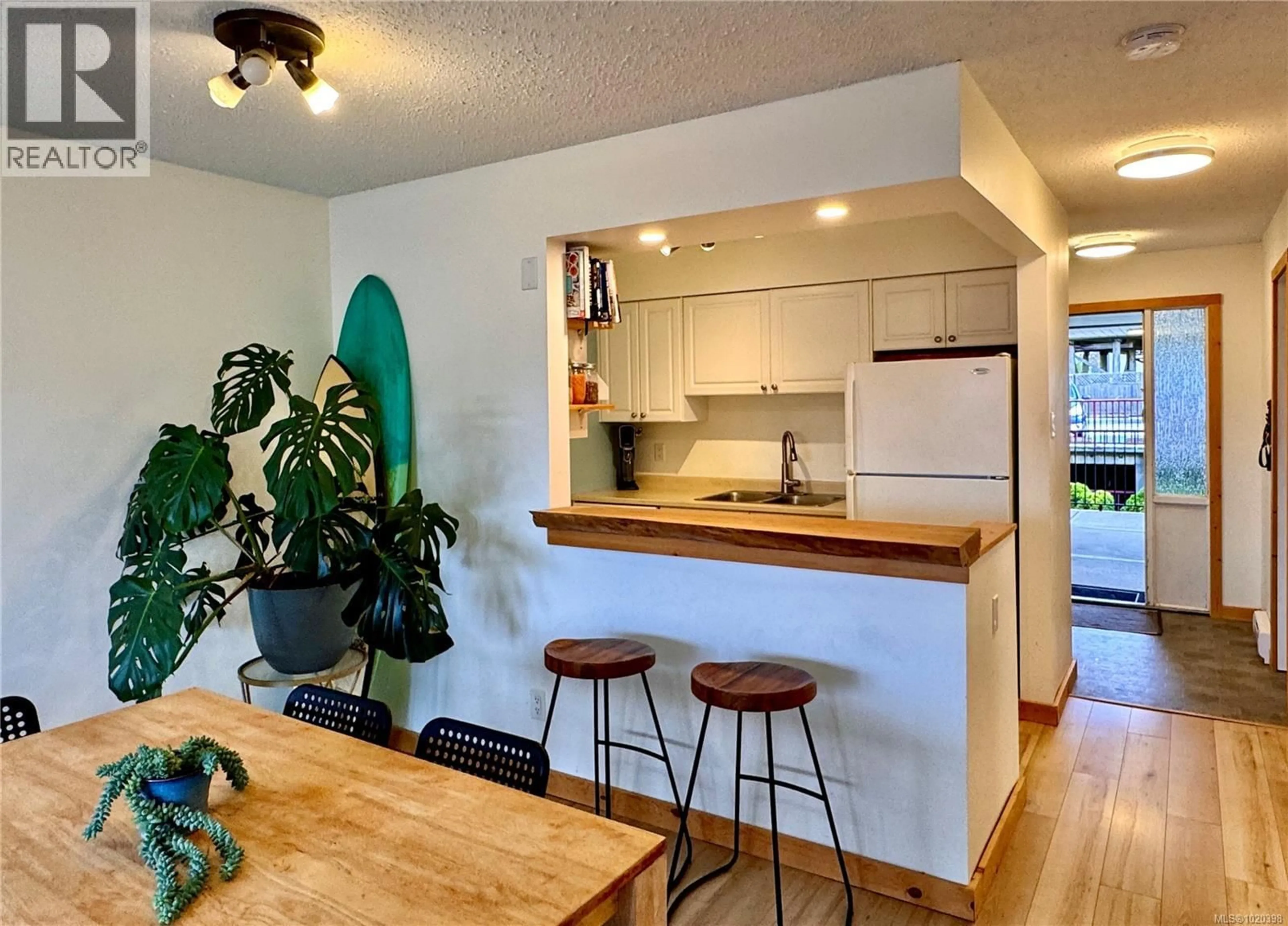 Open concept kitchen, wood/laminate floor for 203 - 250 HEMLOCK STREET, Ucluelet British Columbia V0R3A0