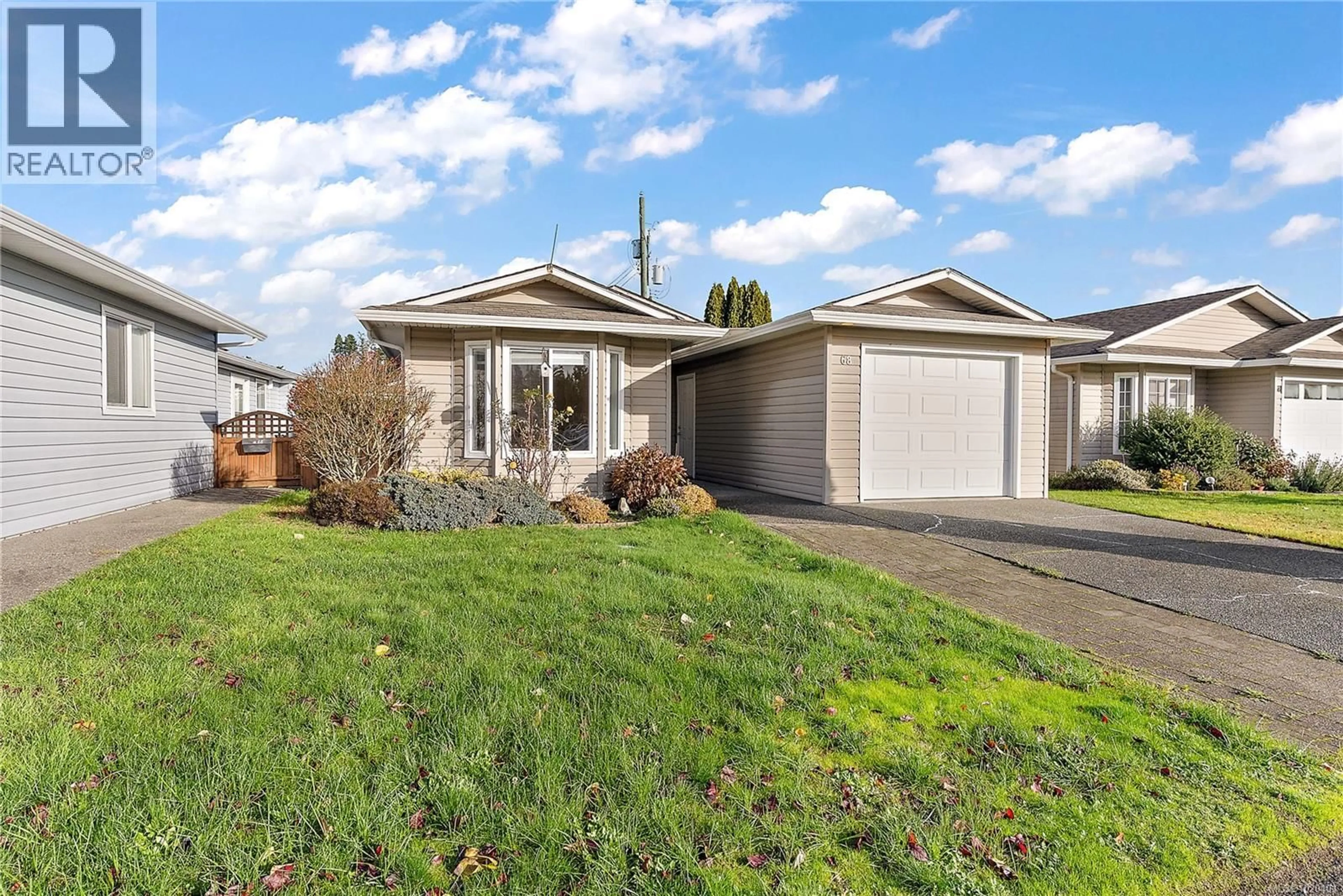 Home with vinyl exterior material, street for 68 - 7570 TETAYUT ROAD, Central Saanich British Columbia V8M2H4