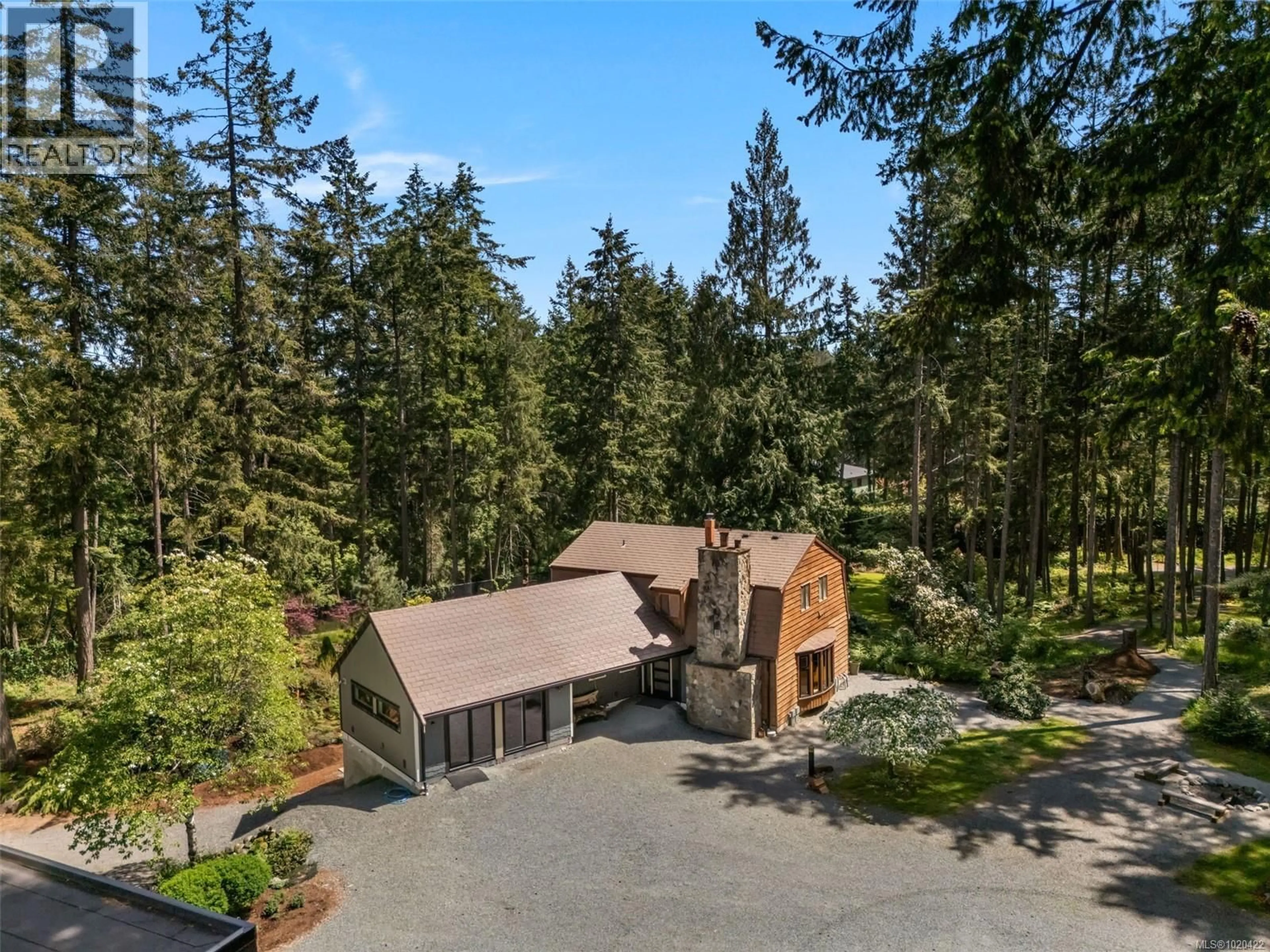 A pic from outside/outdoor area/front of a property/back of a property/a pic from drone, forest/trees view for 3281 MCGUIRE WAY, Nanaimo British Columbia V9G1C4