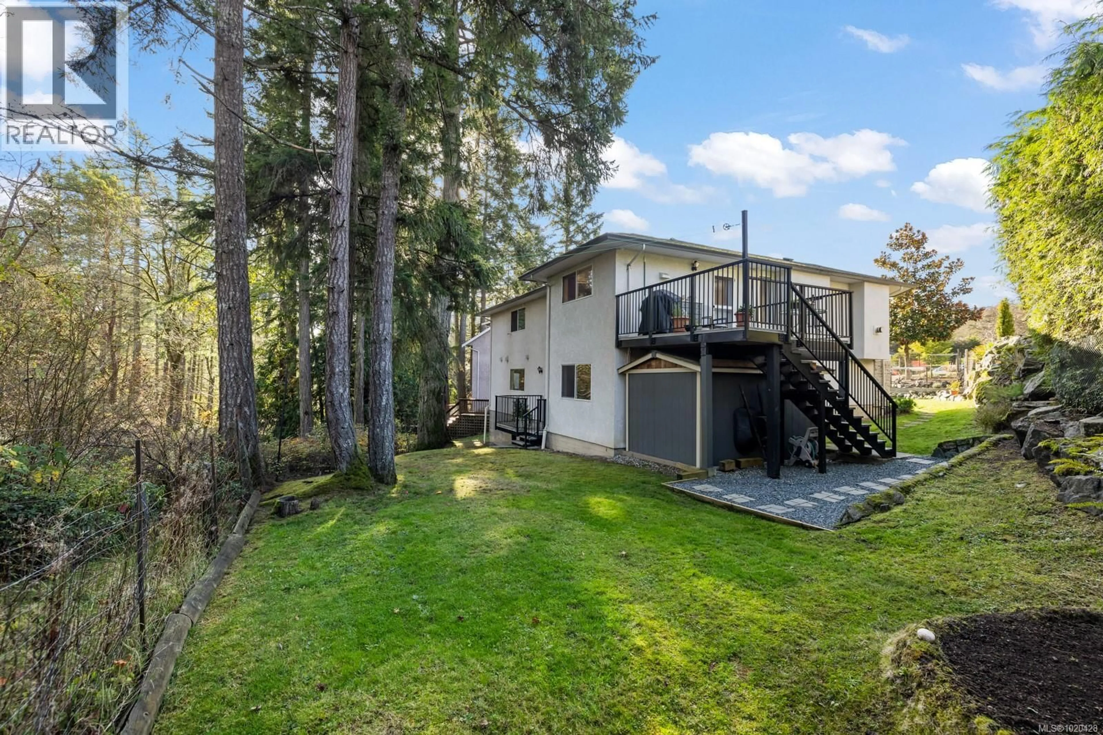 A pic from outside/outdoor area/front of a property/back of a property/a pic from drone, forest/trees view for 77 CHILCO RIDGE PLACE, View Royal British Columbia V9B5Z7