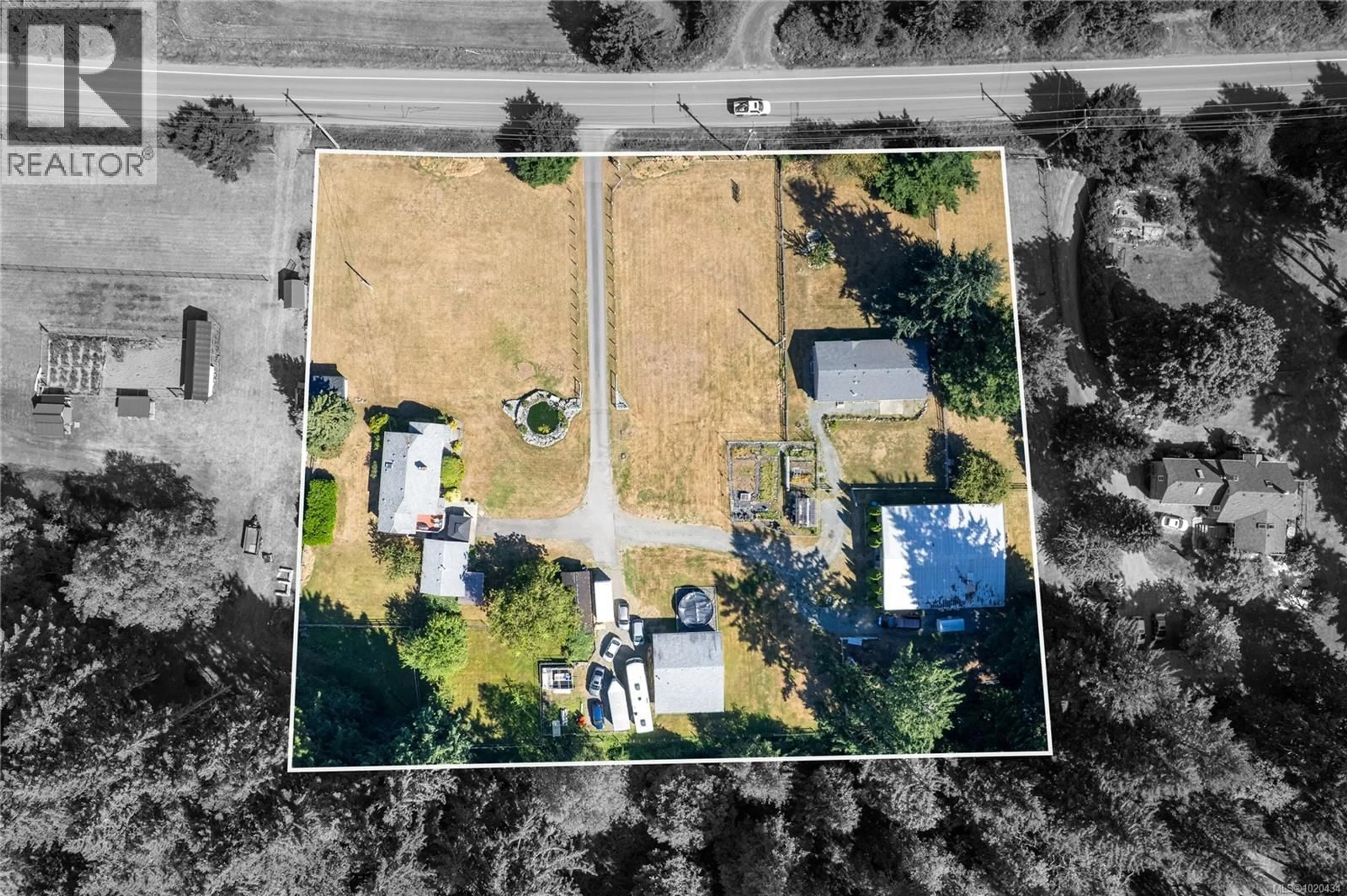 A pic from outside/outdoor area/front of a property/back of a property/a pic from drone, street for 2687 JINGLE POT ROAD, Nanaimo British Columbia V9R6W5