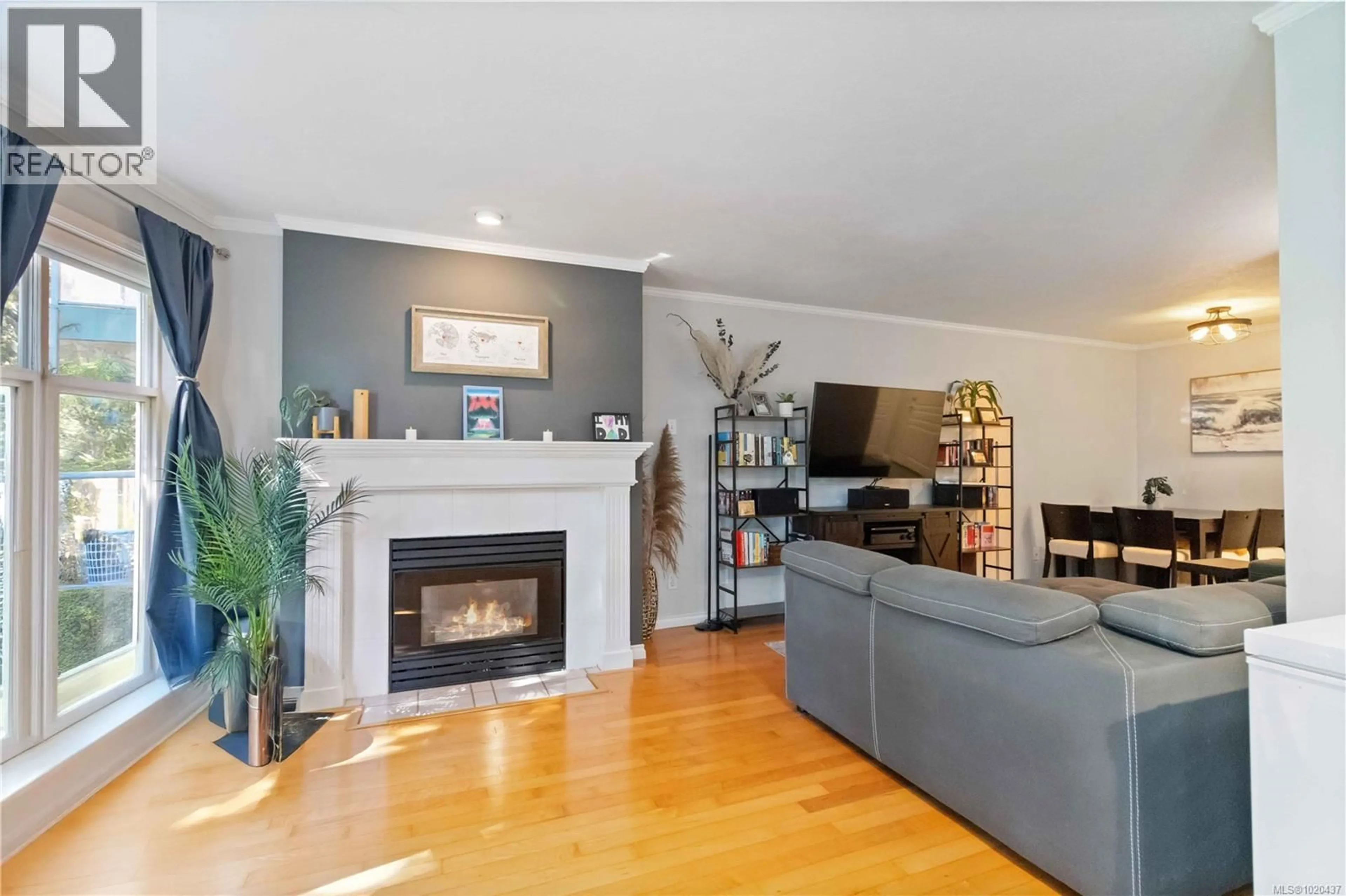 Living room with furniture, wood/laminate floor for 206 - 898 VERNON AVENUE, Saanich British Columbia V8X2W6