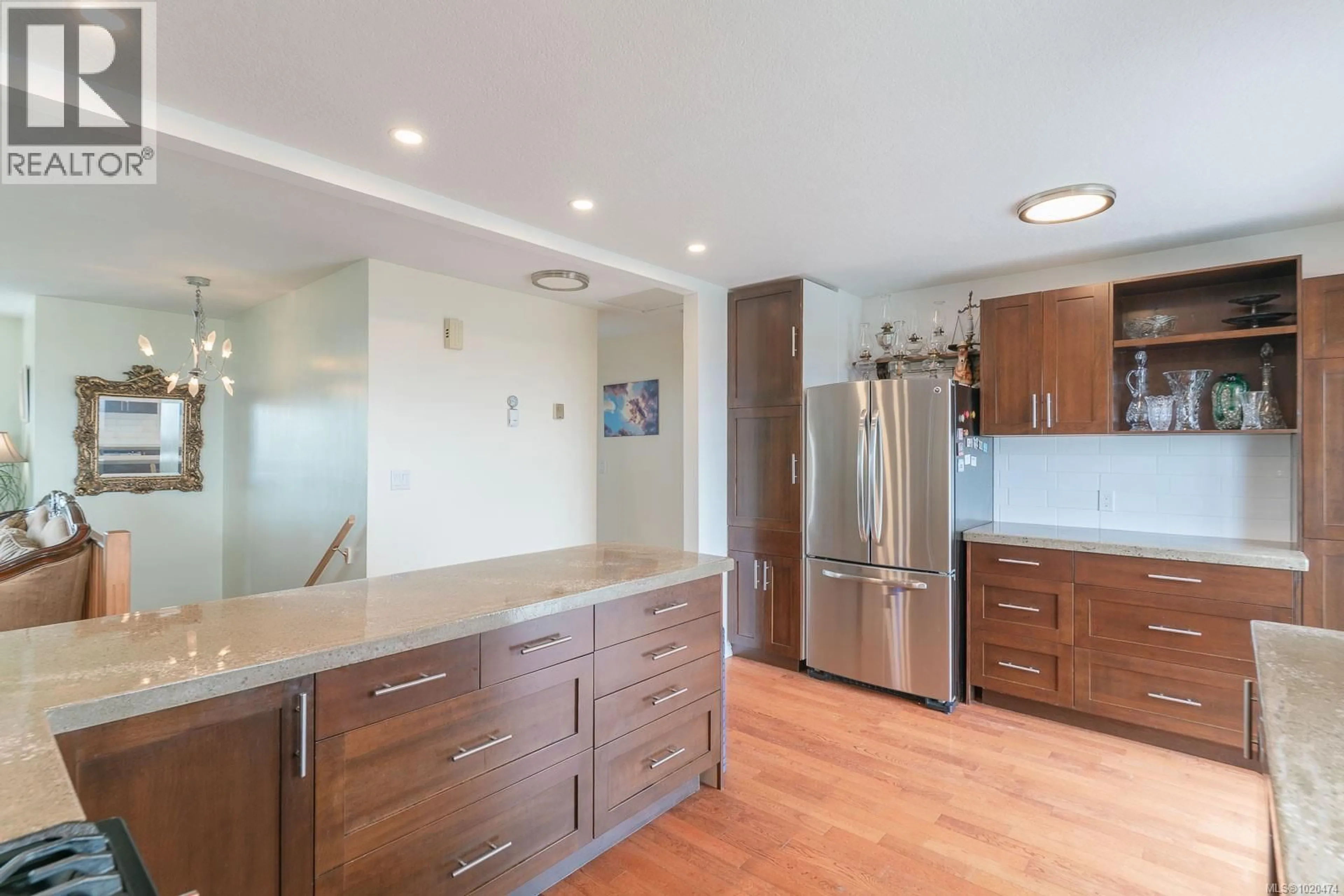 Open concept kitchen, wood/laminate floor for 6234 MYSTIC WAY, Nanaimo British Columbia V9V1L3