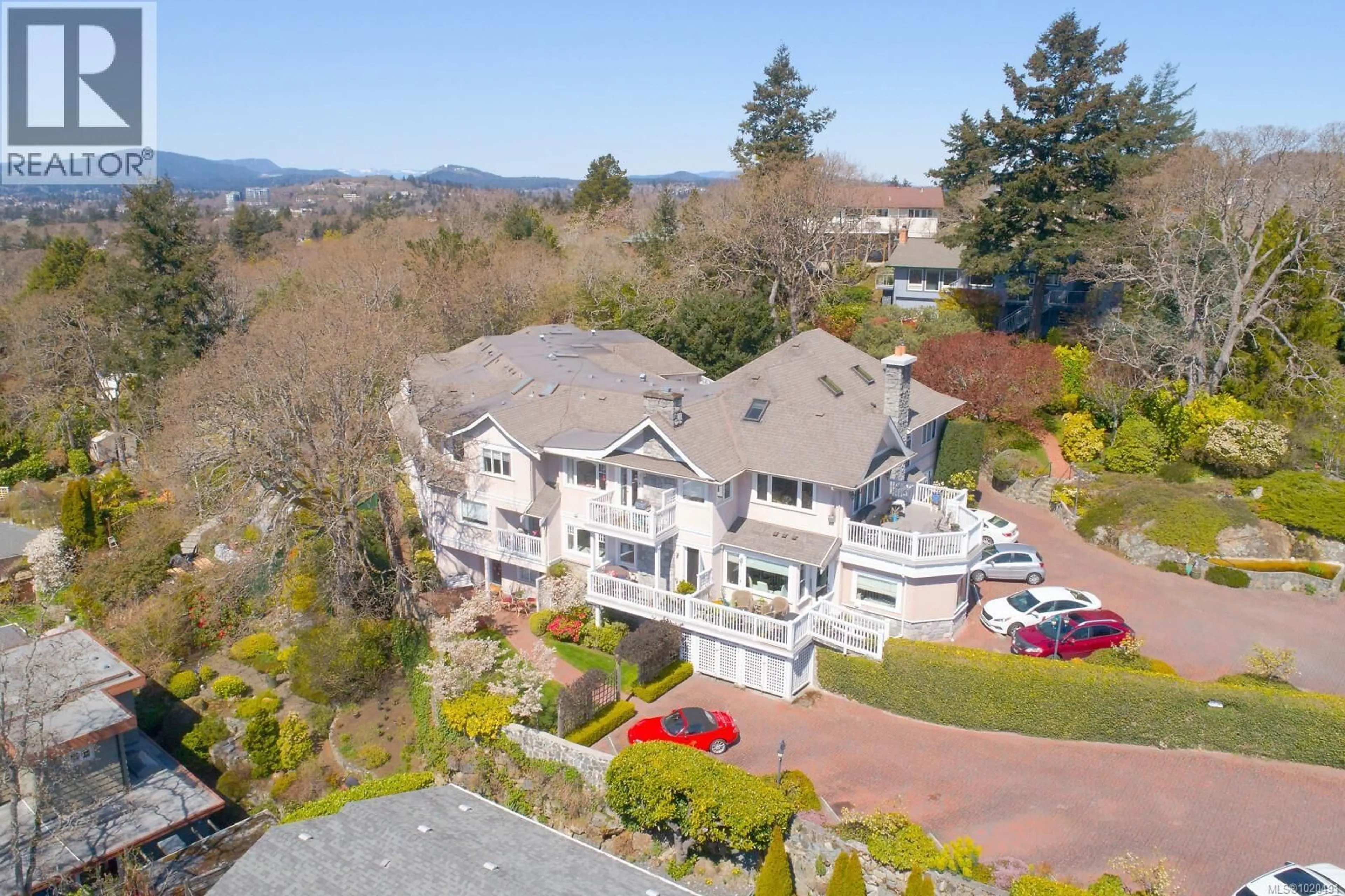 A pic from outside/outdoor area/front of a property/back of a property/a pic from drone, mountain view for 104 - 1196 CLOVELLY TERRACE, Saanich British Columbia V8P1V6