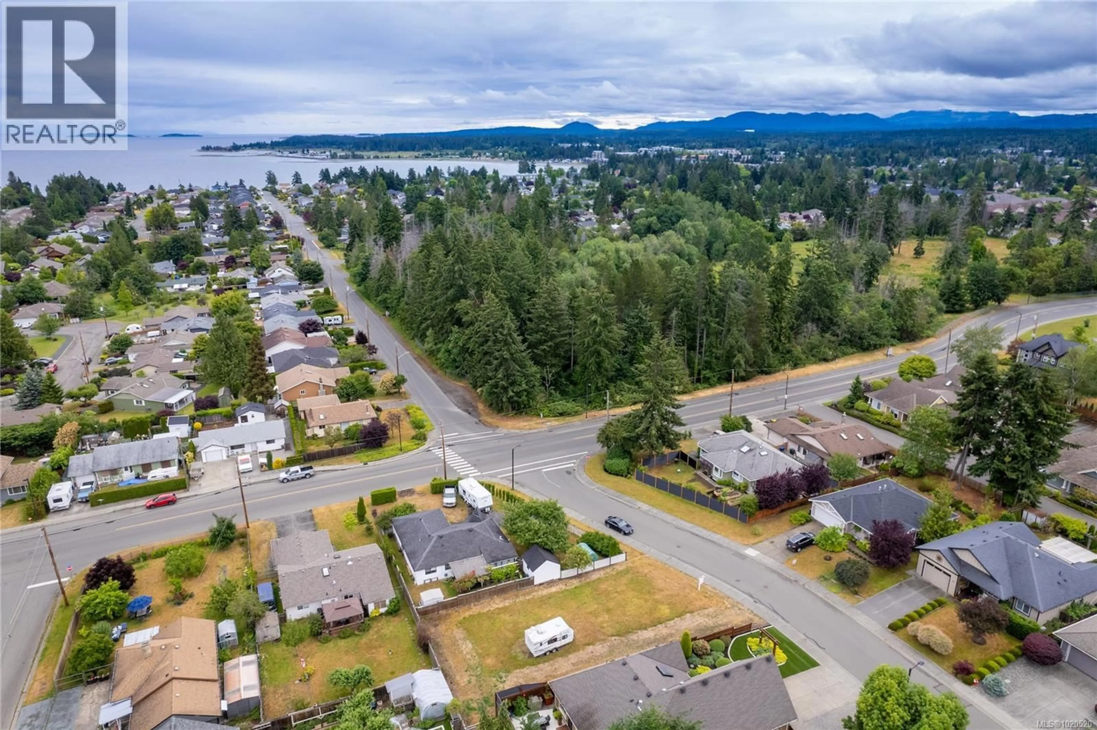 A pic from outside/outdoor area/front of a property/back of a property/a pic from drone, water/lake/river/ocean view for 715 DOEHLE AVENUE, Parksville British Columbia V9P2V1