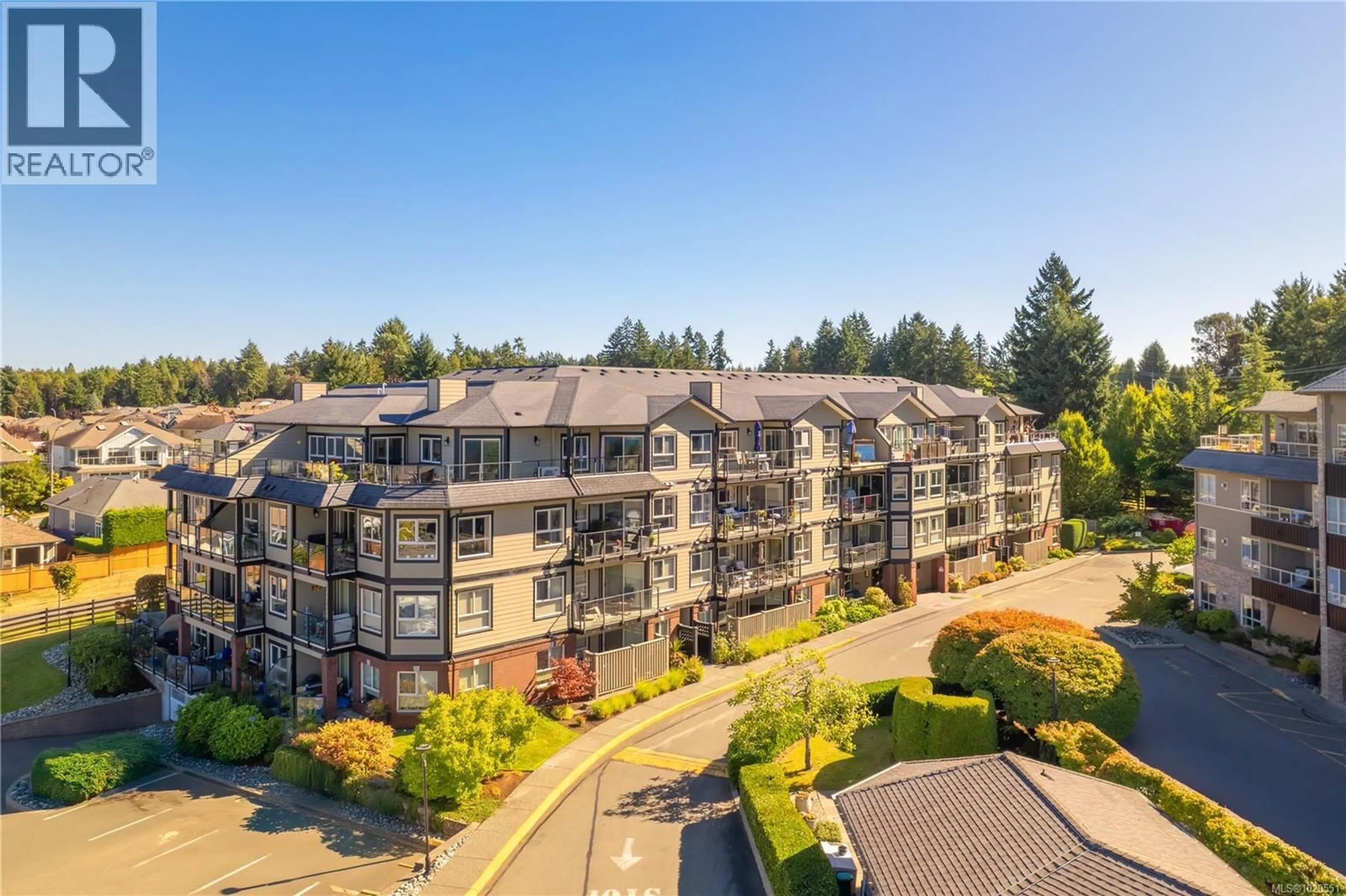 A pic from outside/outdoor area/front of a property/back of a property/a pic from drone, unknown for 212 - 6728 DICKINSON ROAD, Nanaimo British Columbia V9T1T3