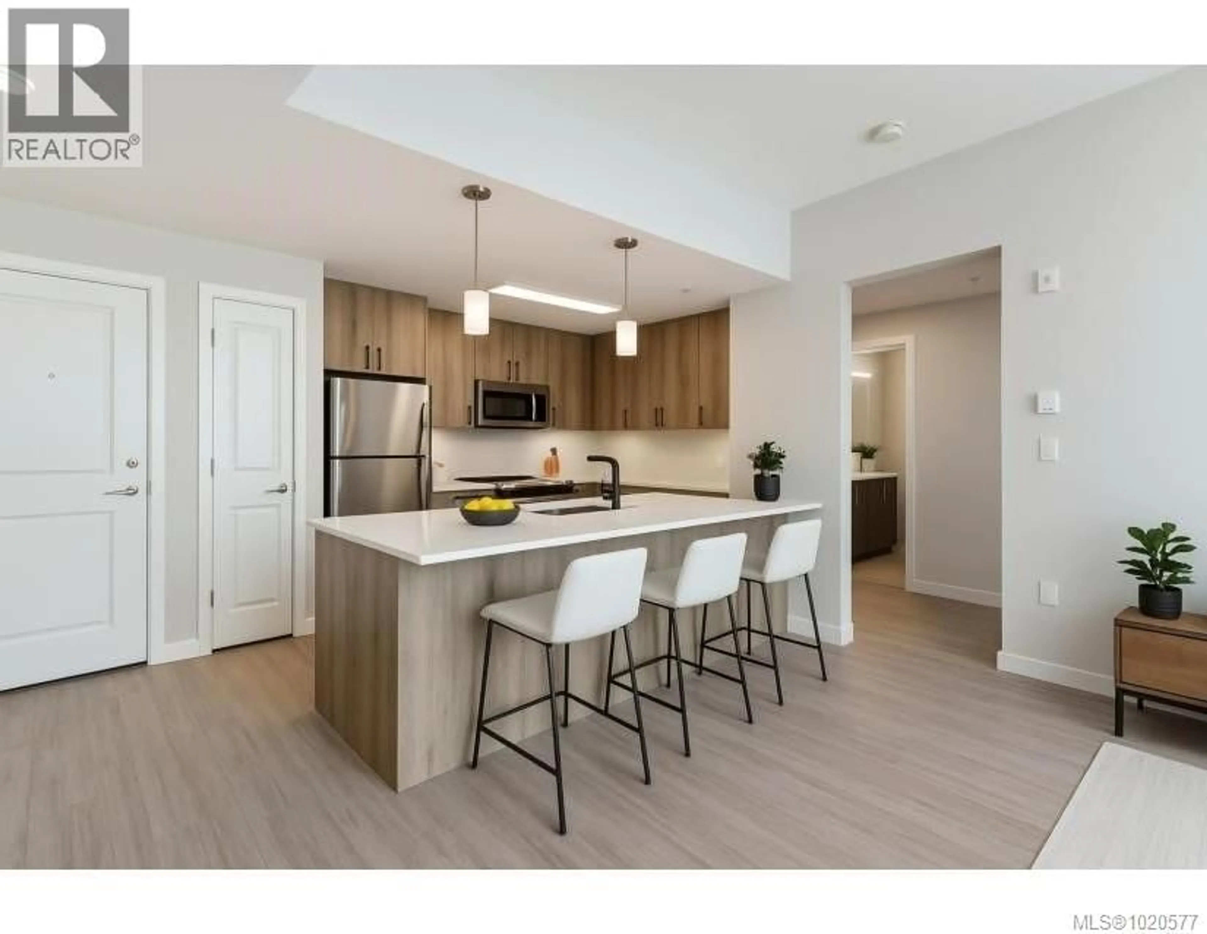 Open concept kitchen, wood/laminate floor for 301 - 100 PRESLEY PLACE, View Royal British Columbia V9B0H5