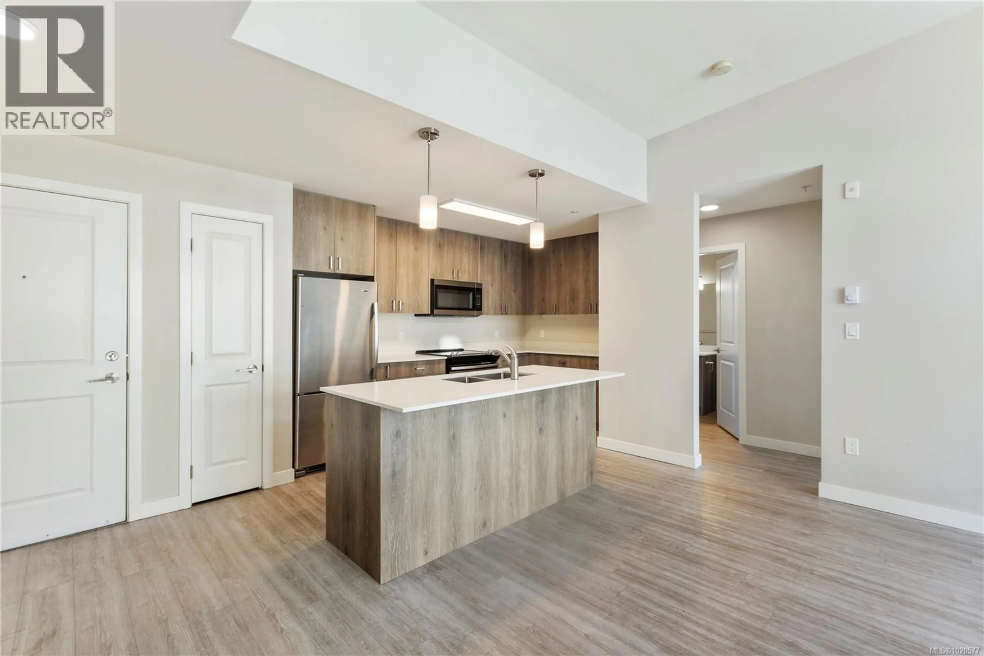 Open concept kitchen, wood/laminate floor for 301 - 100 PRESLEY PLACE, View Royal British Columbia V9B0H5