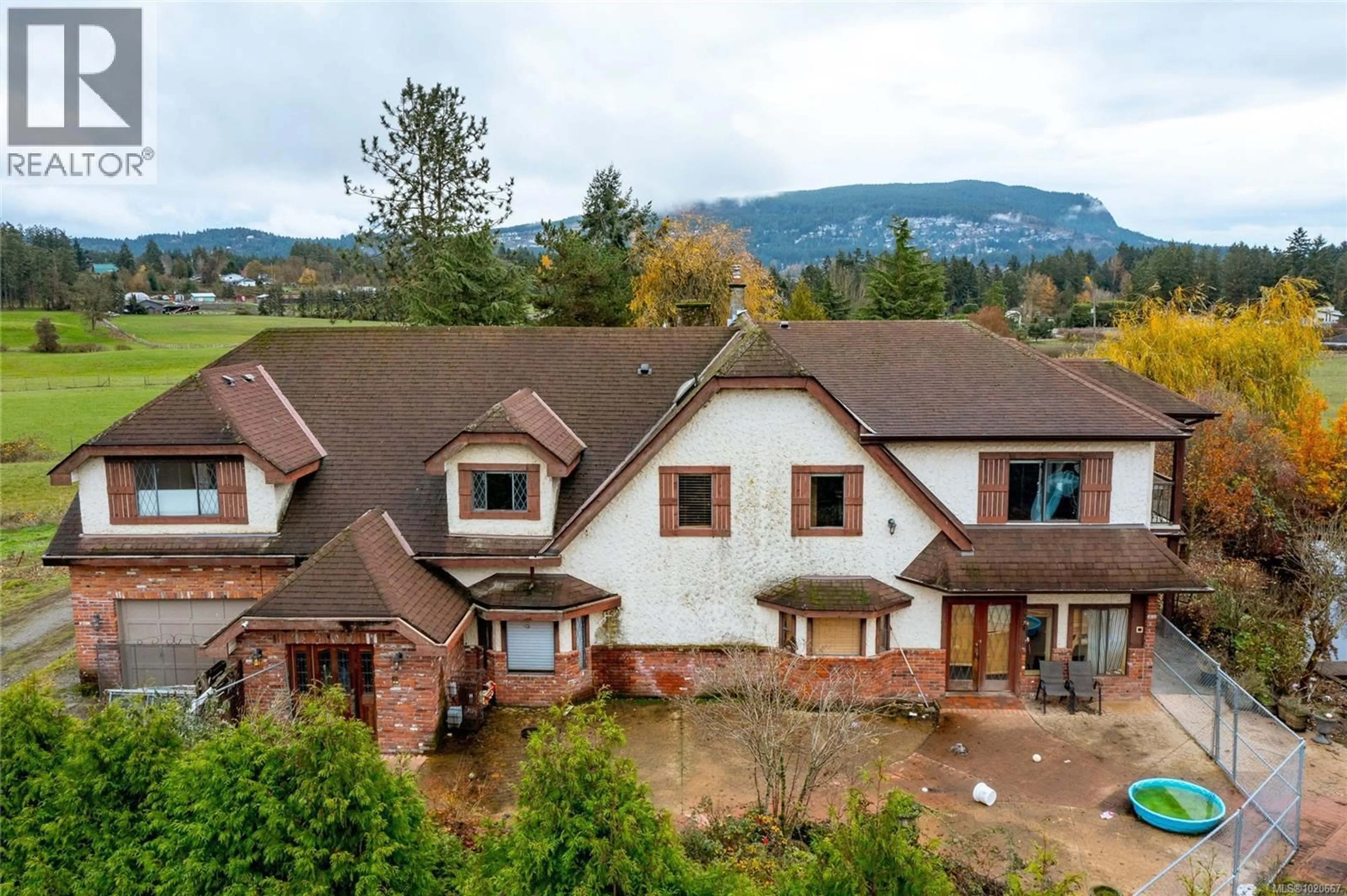 A pic from outside/outdoor area/front of a property/back of a property/a pic from drone, mountain view for 1909 STAMPS ROAD, Duncan British Columbia V9L5W1