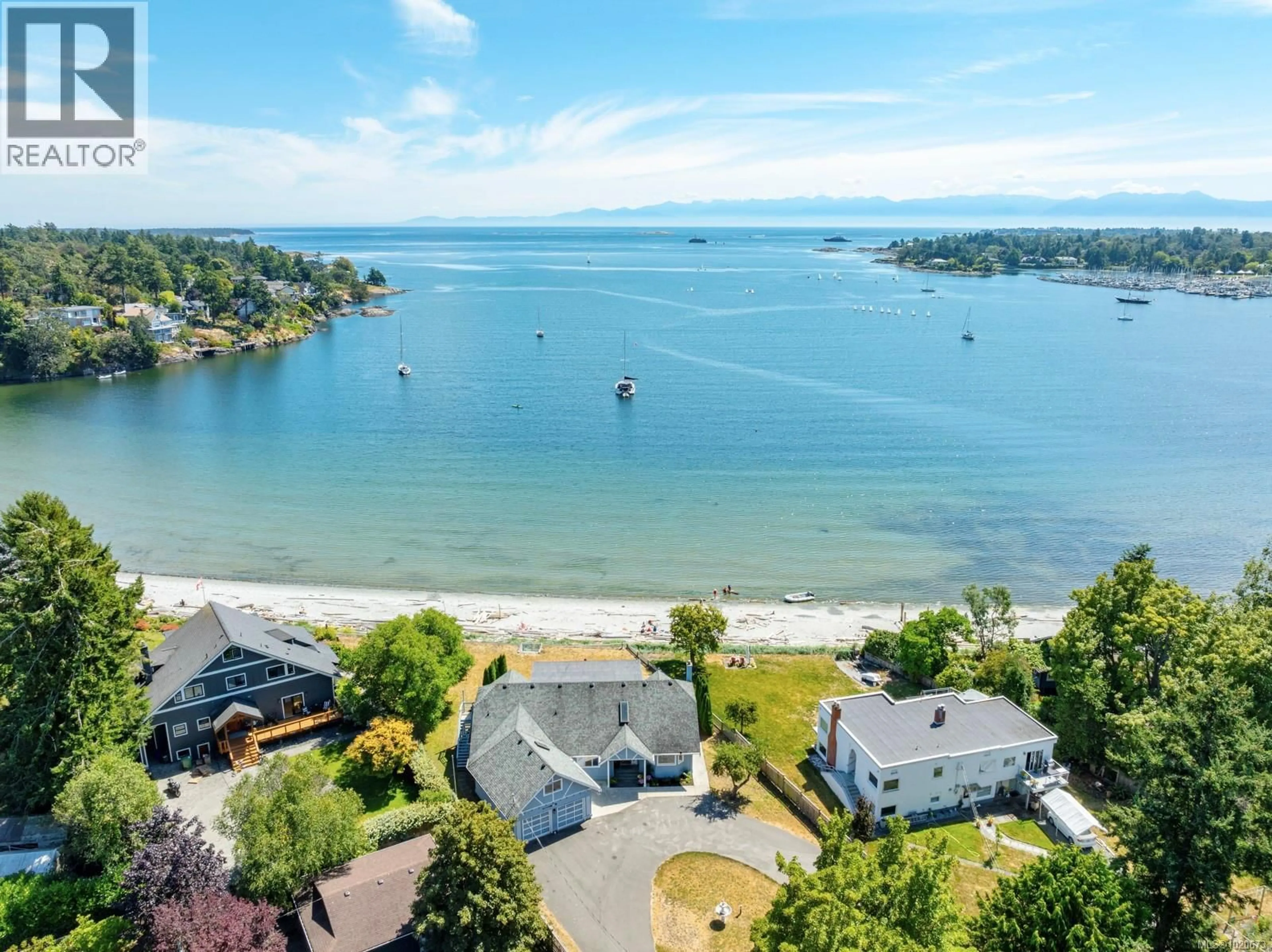 A pic from outside/outdoor area/front of a property/back of a property/a pic from drone, water/lake/river/ocean view for 3905B CADBORO BAY ROAD, Saanich British Columbia V8N4G3