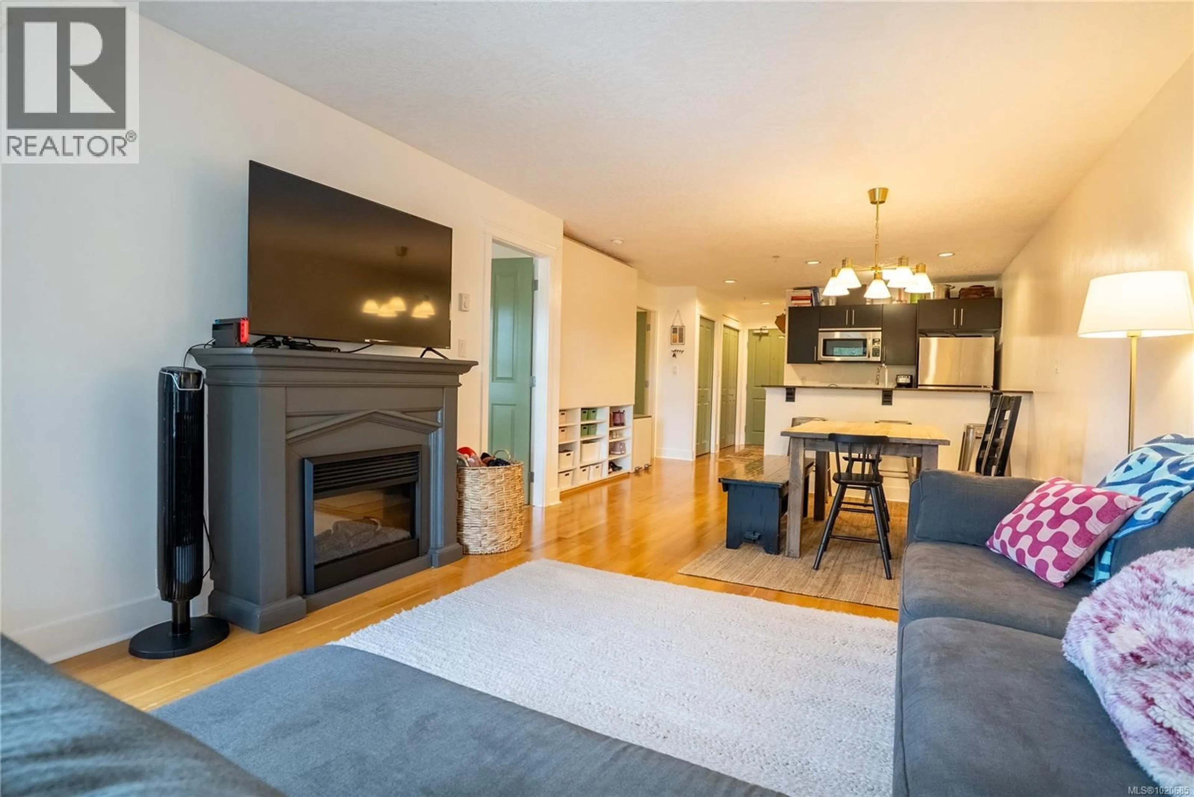 Living room with furniture, wood/laminate floor for 306 - 2717 PEATT ROAD, Langford British Columbia V9B3V2
