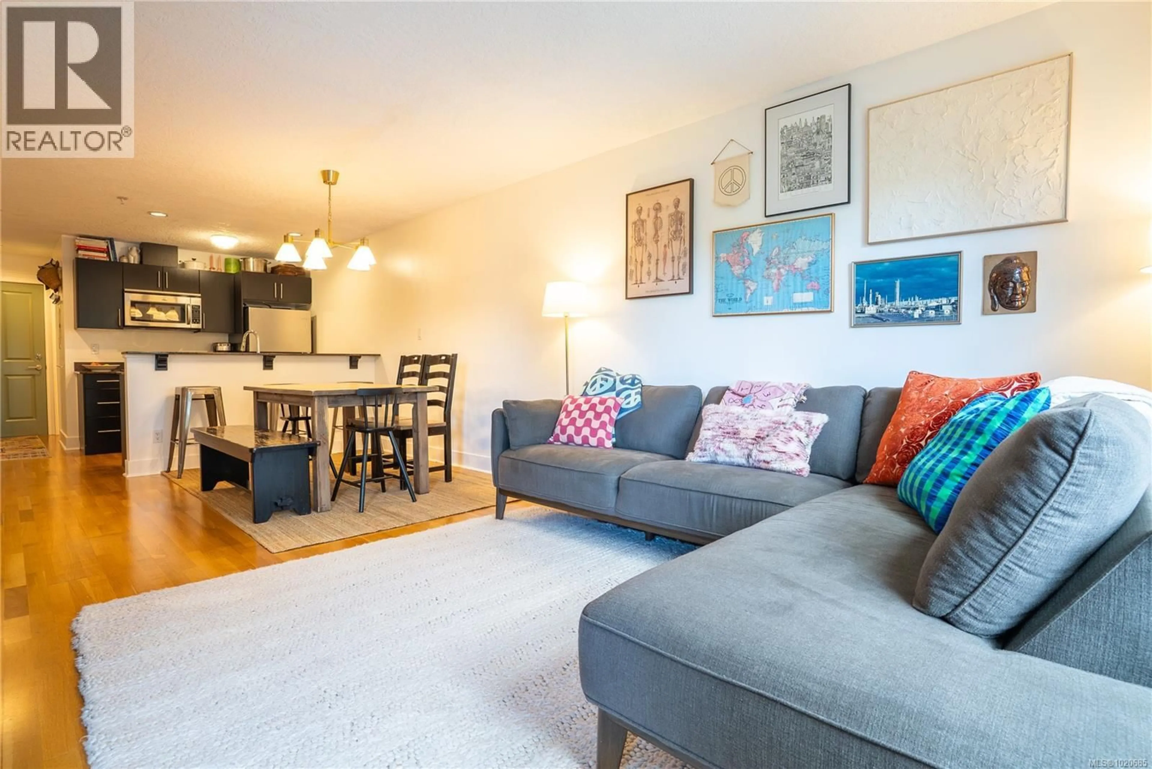 Living room with furniture, wood/laminate floor for 306 - 2717 PEATT ROAD, Langford British Columbia V9B3V2