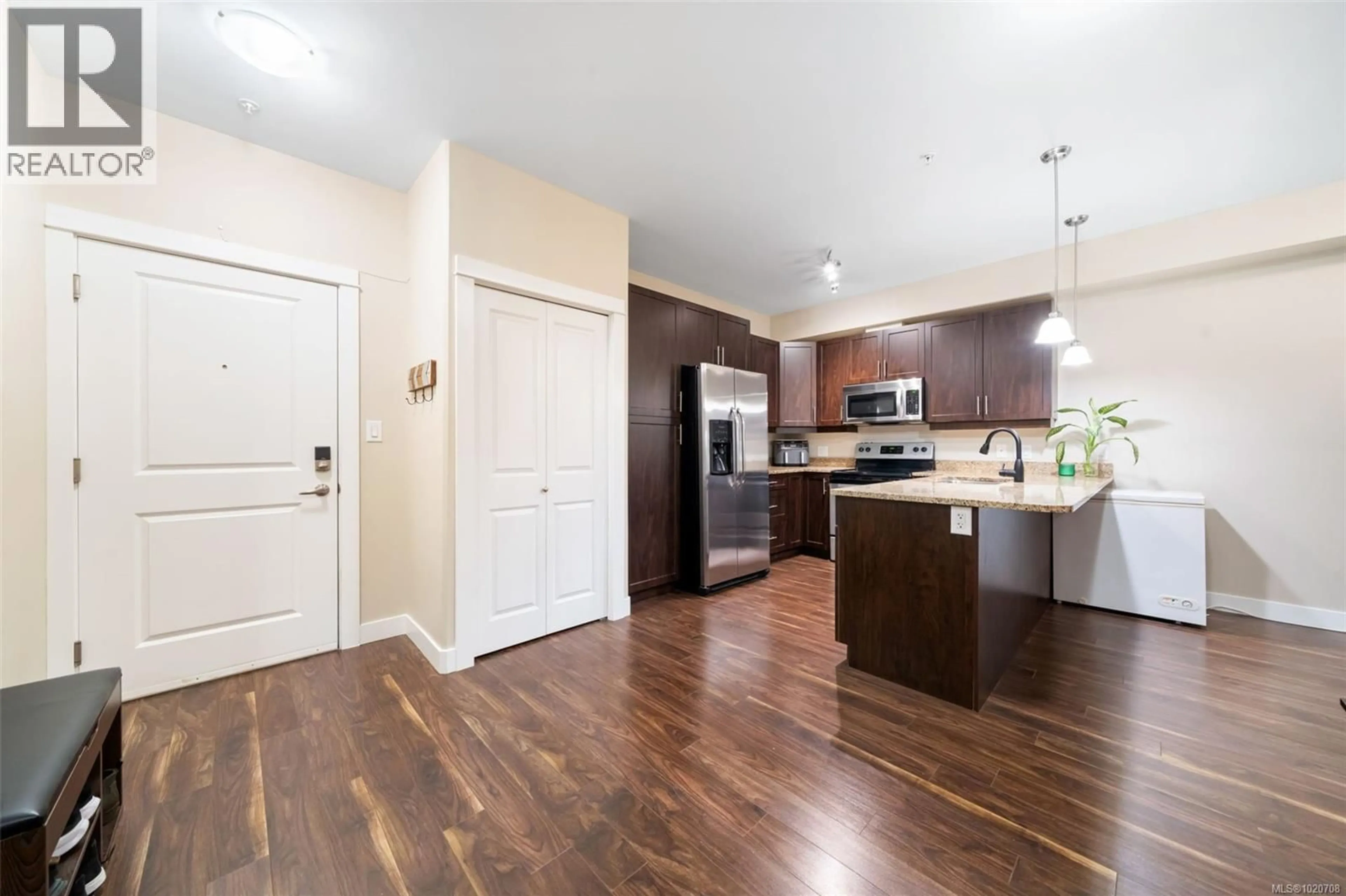 Open concept kitchen, wood/laminate floor for 113 - 938 DUNFORD AVENUE, Langford British Columbia V9B0M2