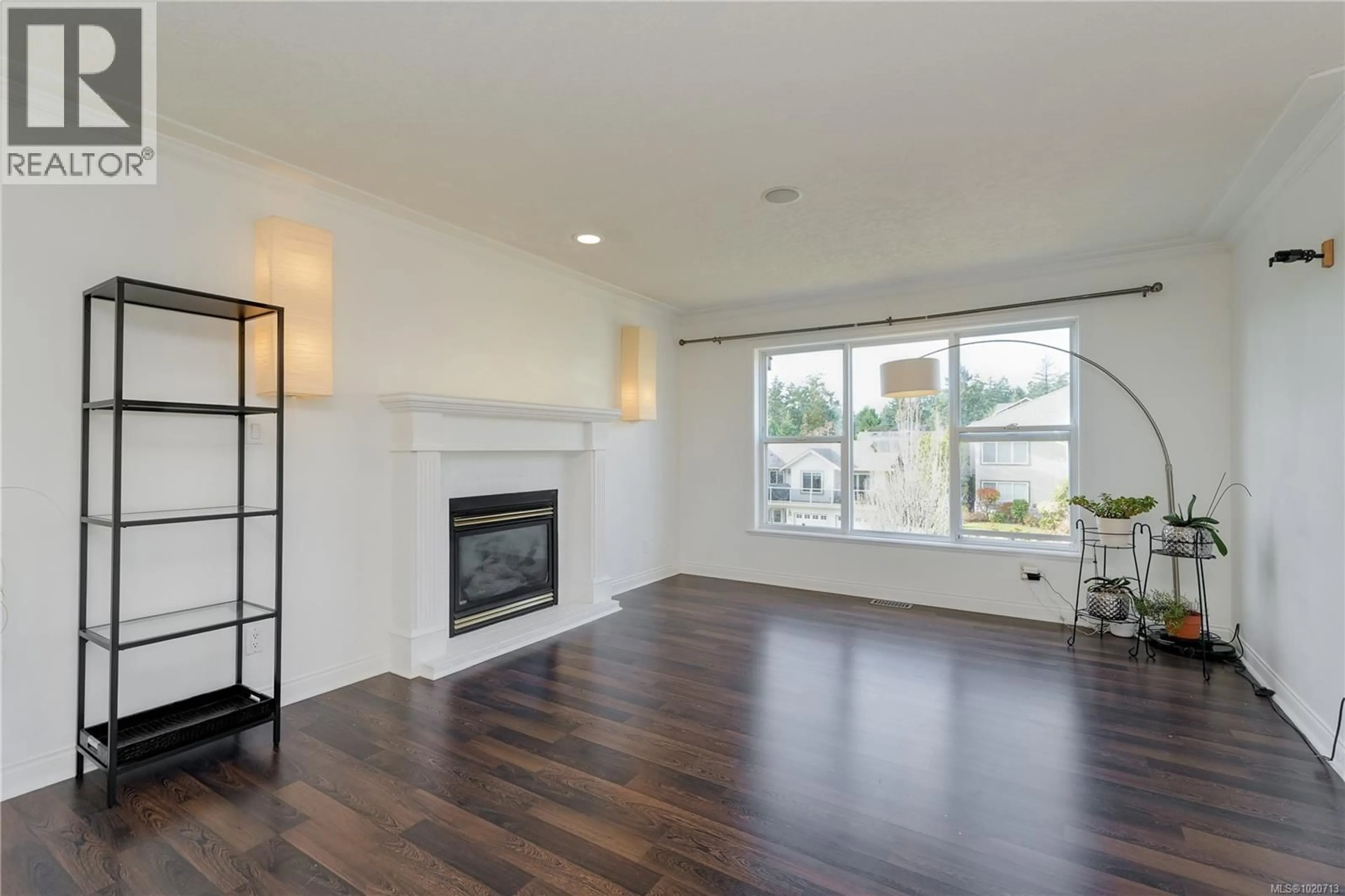 Living room with furniture, wood/laminate floor for 2687 SILVERSTONE WAY, Langford British Columbia V9B6A6