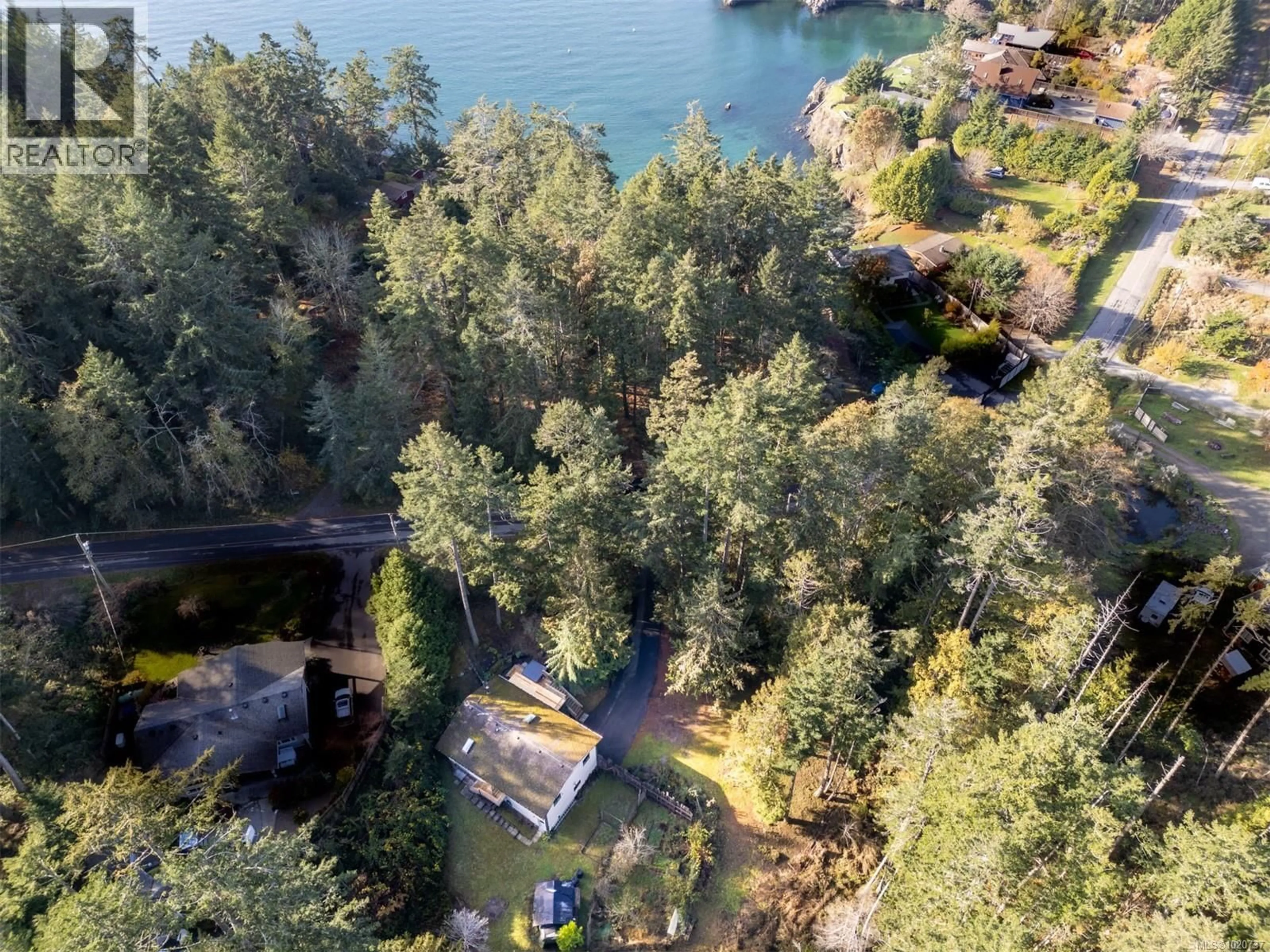 A pic from outside/outdoor area/front of a property/back of a property/a pic from drone, water/lake/river/ocean view for 37150 SCHOONER WAY, Pender Island British Columbia V0N2M2