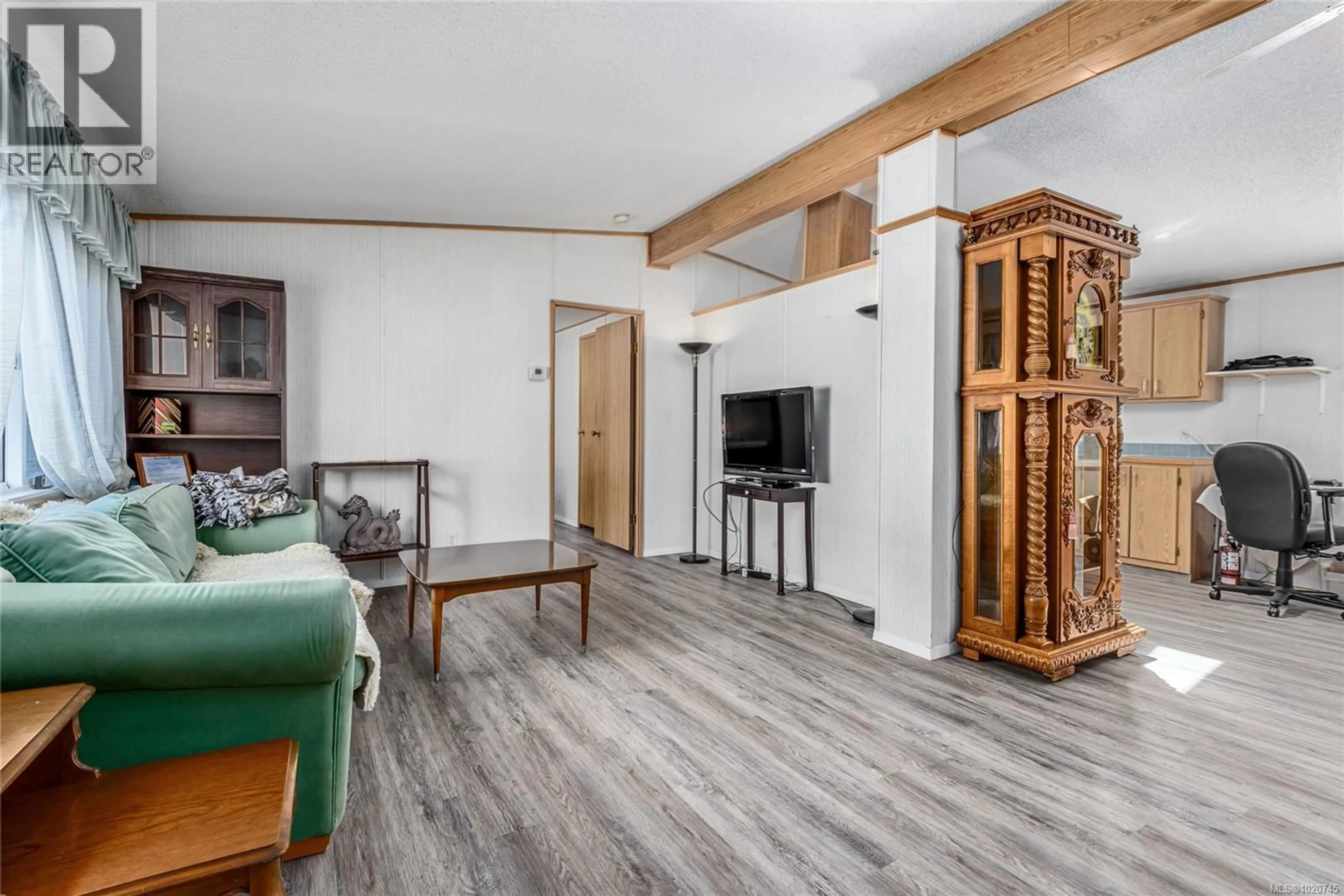 Living room with furniture, wood/laminate floor for 1 - 2200 LAMBERT DRIVE, Courtenay British Columbia V9N9E1