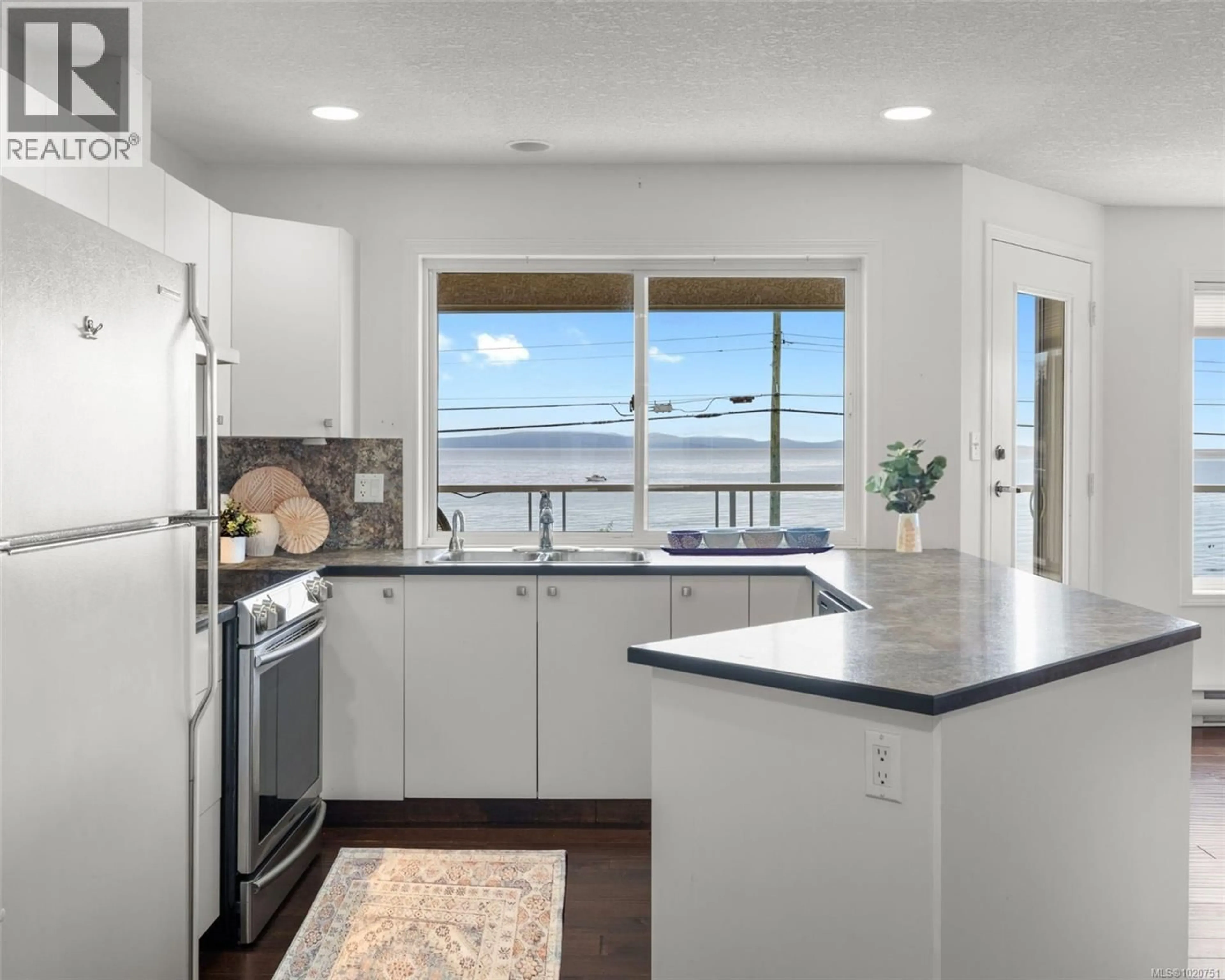 Open concept kitchen, unknown for 103 - 3156 ISLAND HIGHWAY WEST, Qualicum Beach British Columbia V9K2C6