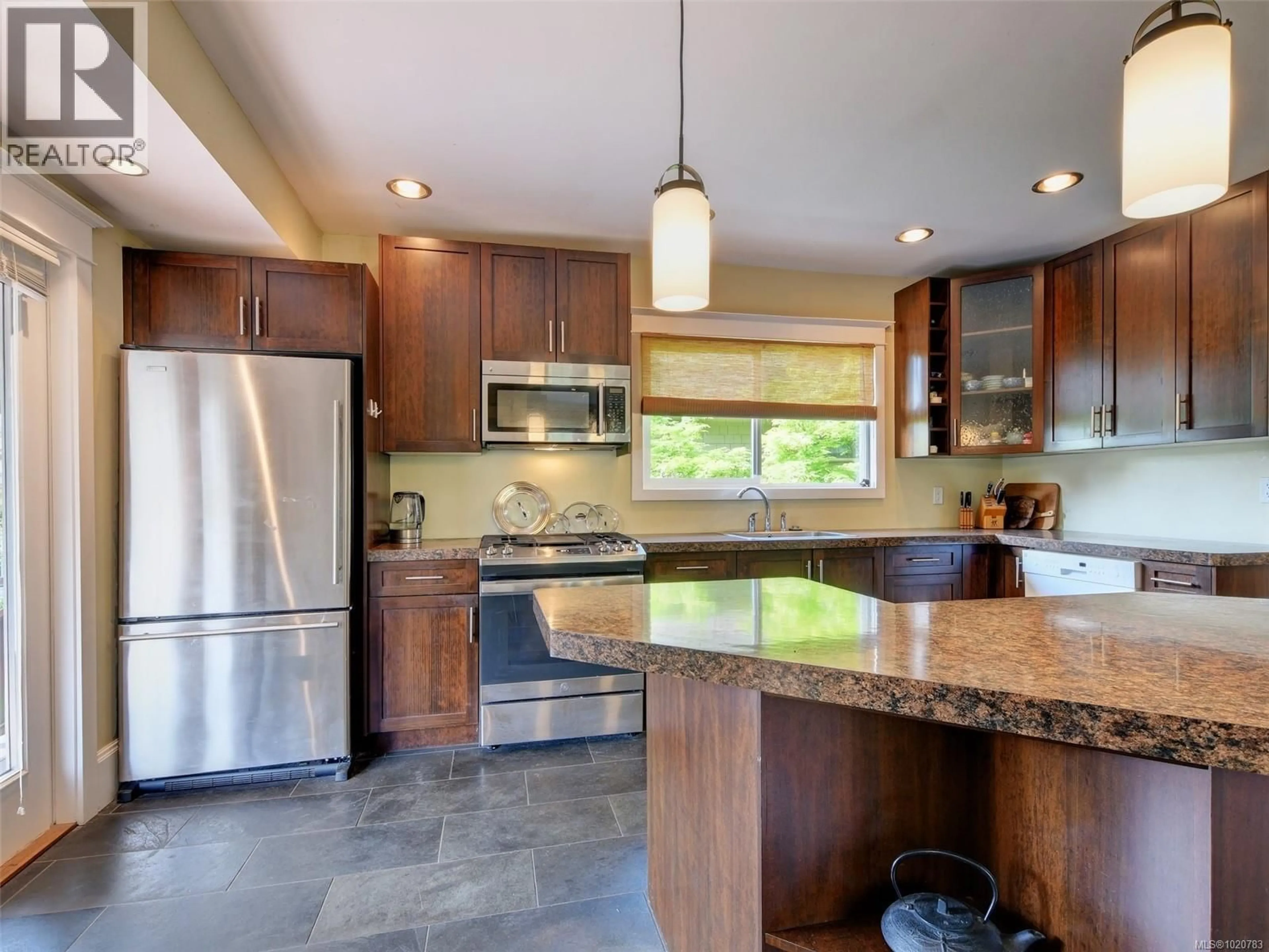 Open concept kitchen, ceramic/tile floor for 2723 MT. STEPHEN AVENUE, Victoria British Columbia V8T3L8