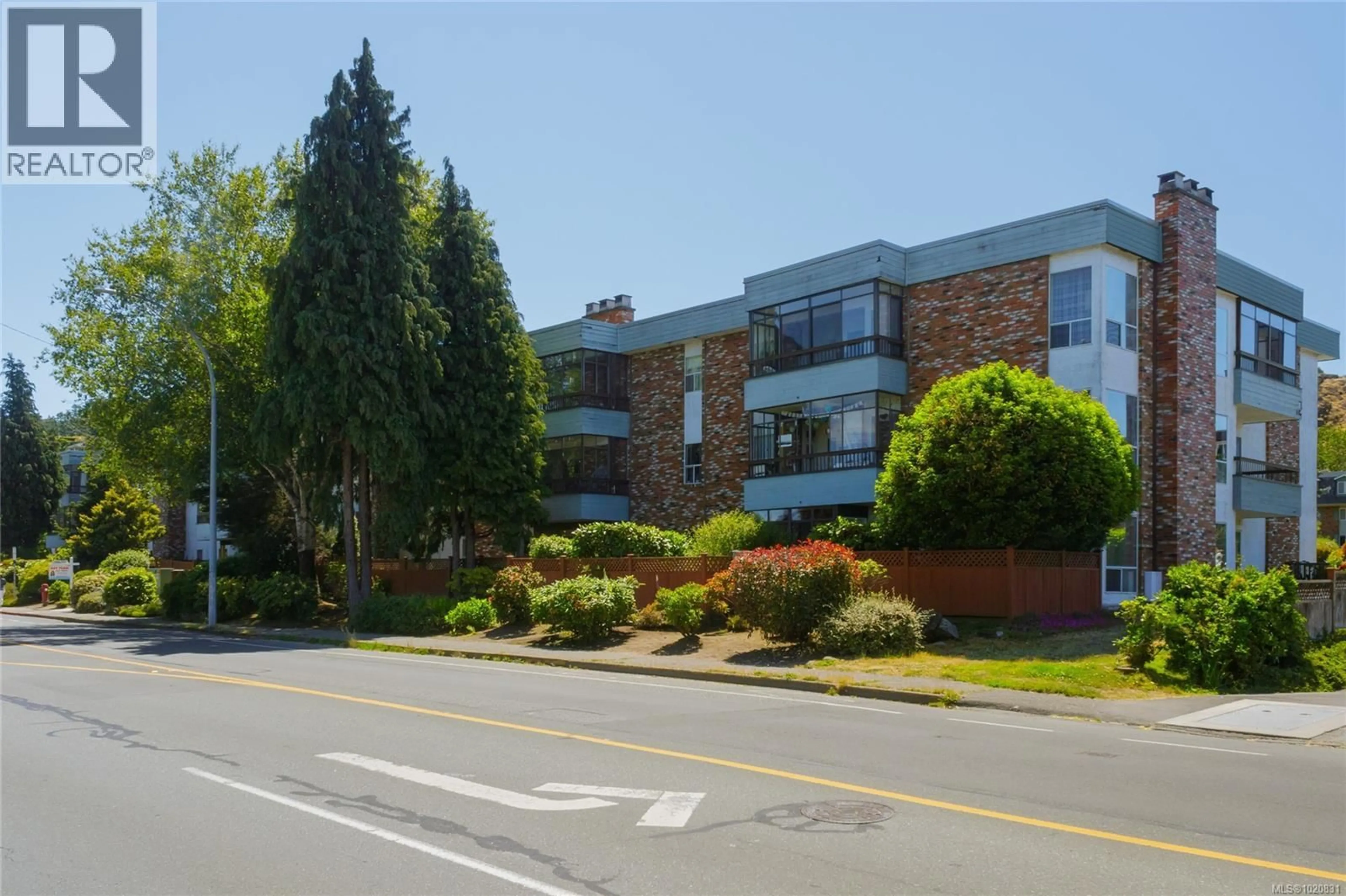 A pic from outside/outdoor area/front of a property/back of a property/a pic from drone, street for 203 - 1725 CEDAR HILL CROSS ROAD EAST, Saanich British Columbia V8P2P8