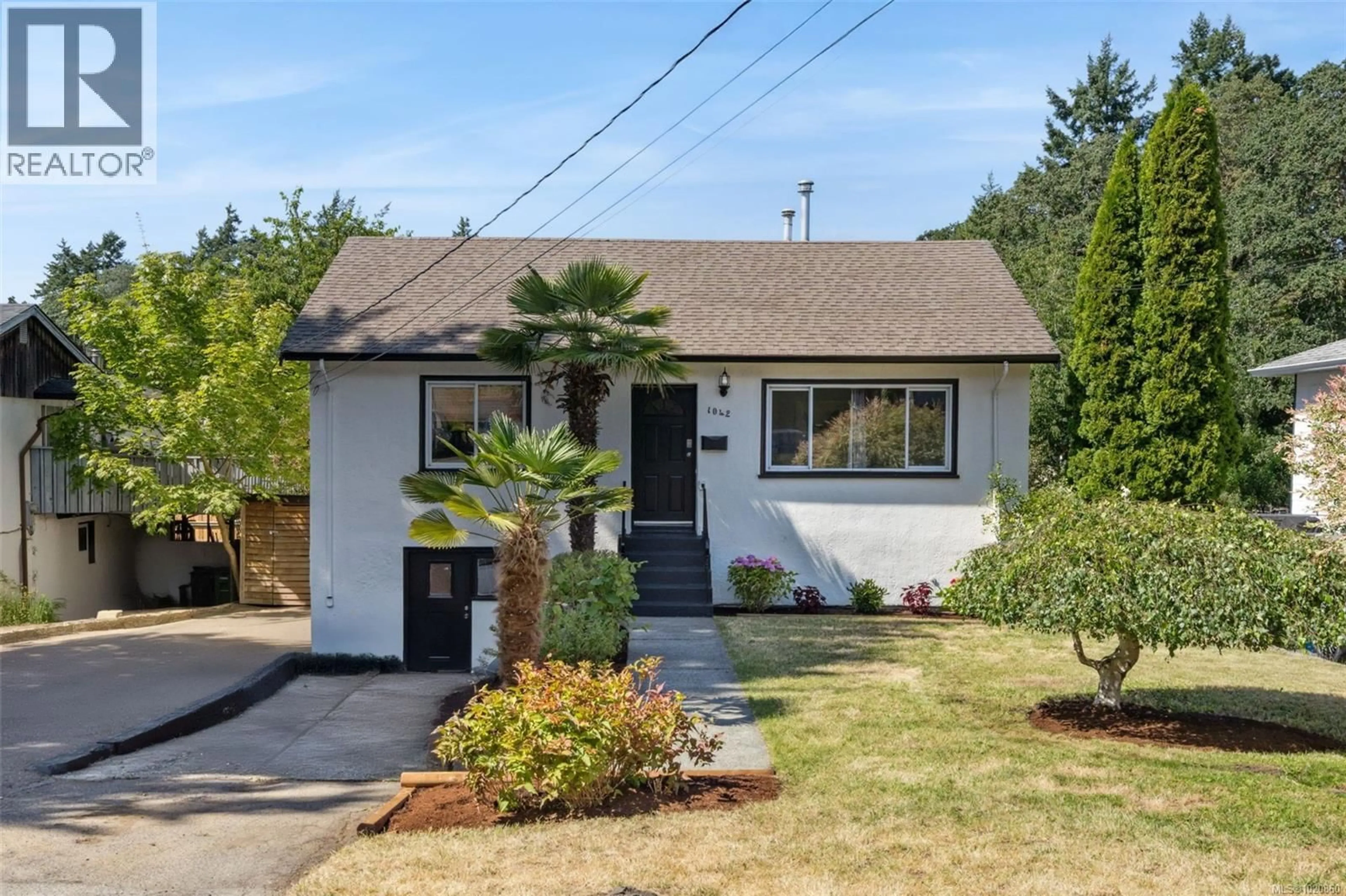 Home with vinyl exterior material, street for 1042 LODGE AVENUE, Saanich British Columbia V8X3A8