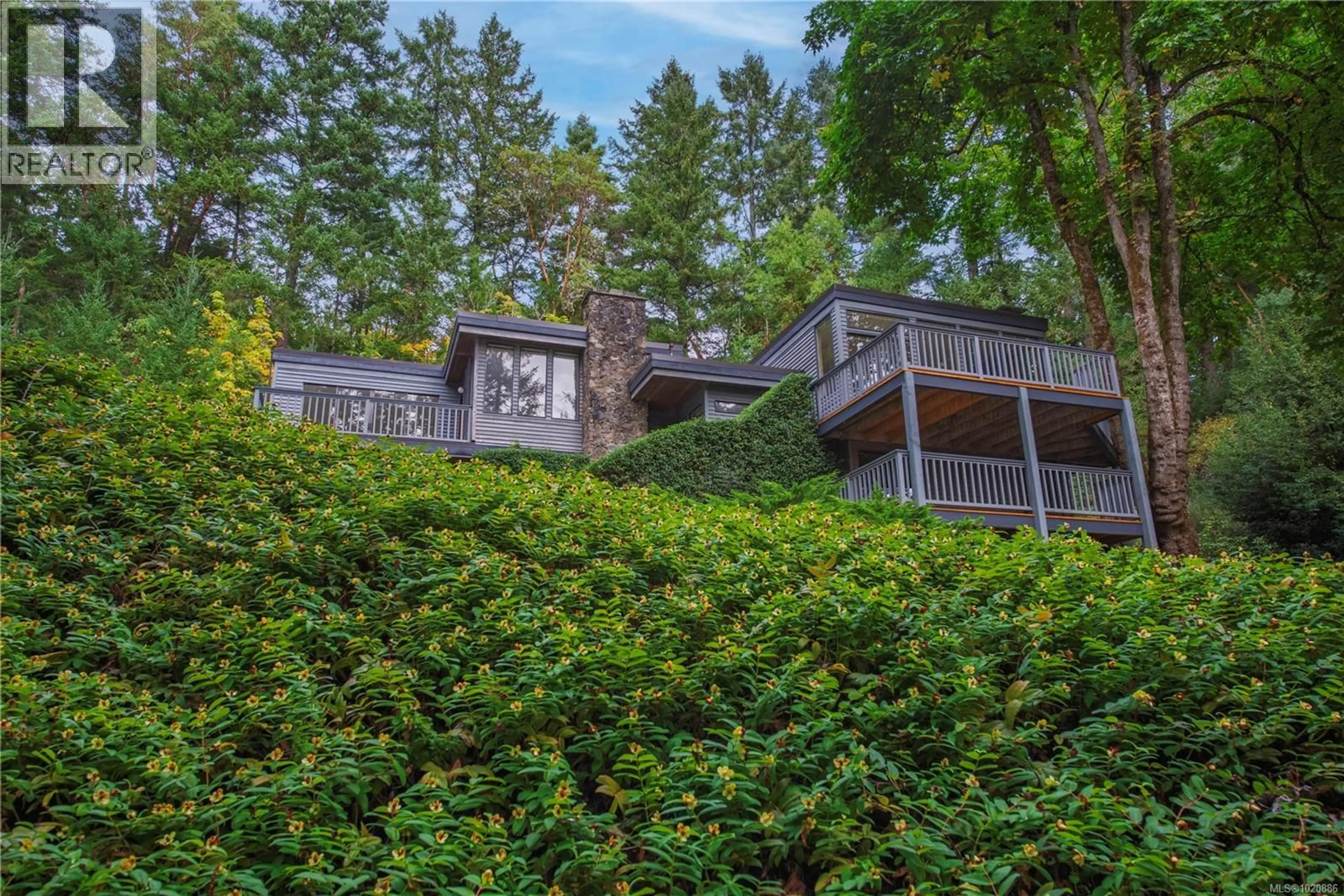 A pic from outside/outdoor area/front of a property/back of a property/a pic from drone, forest/trees view for 1252 TATLOW ROAD, North Saanich British Columbia V8L5R3