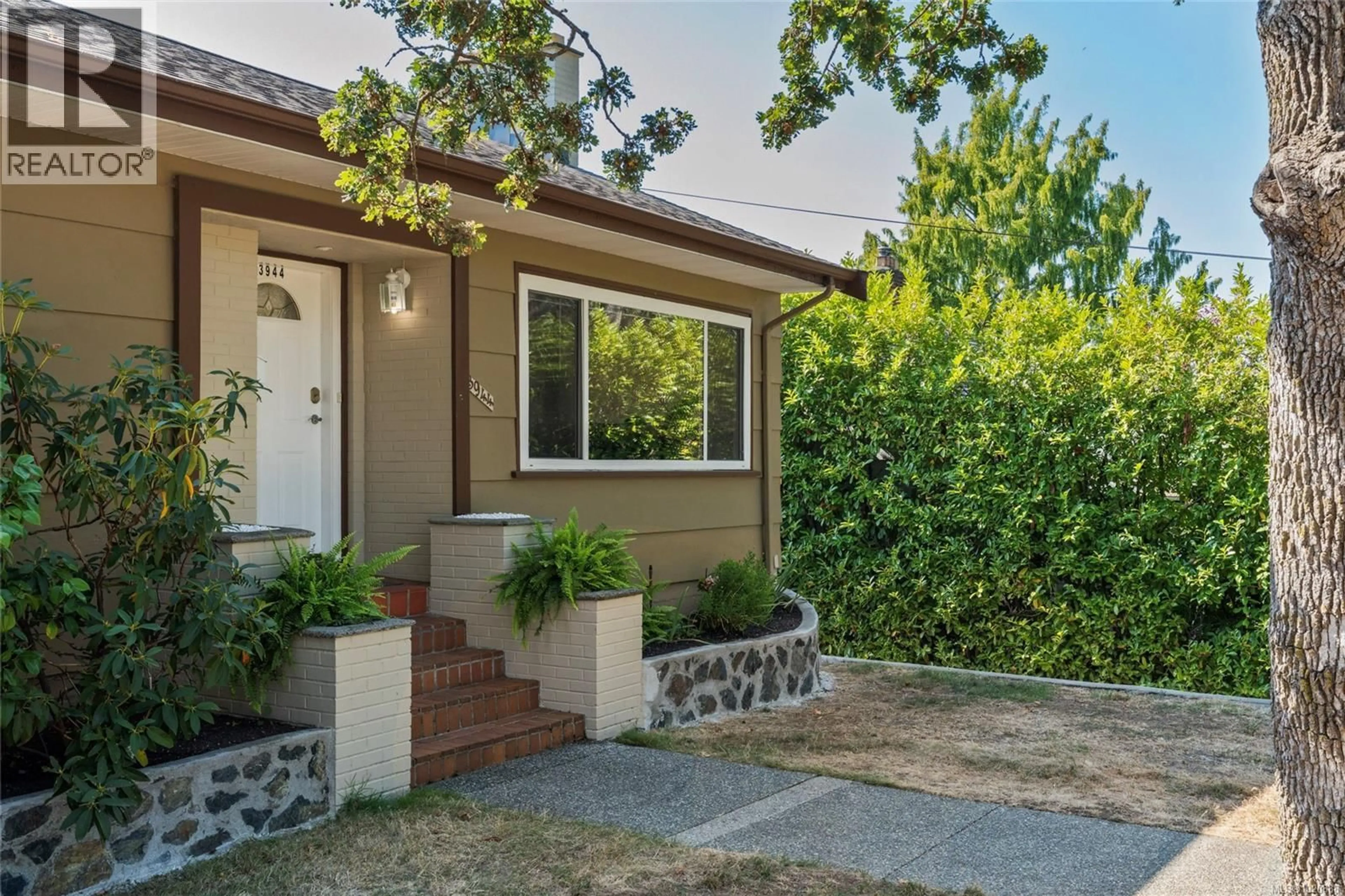 Home with vinyl exterior material, street for 3944 CEDAR HILL CROSS ROAD, Saanich British Columbia V8P2N6