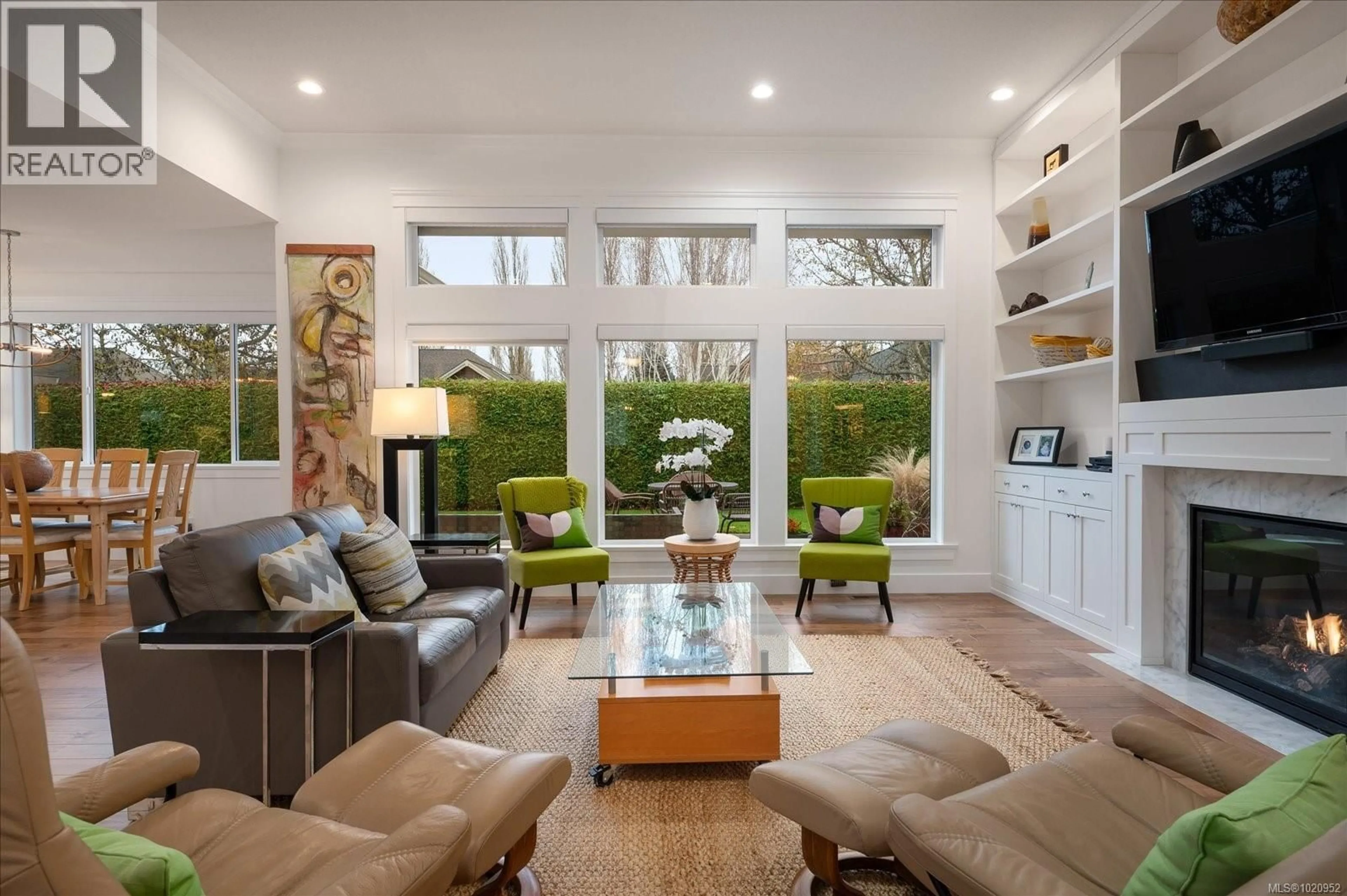 Living room with furniture, wood/laminate floor for 834 BLUFFS DRIVE, Qualicum Beach British Columbia V9K0A2
