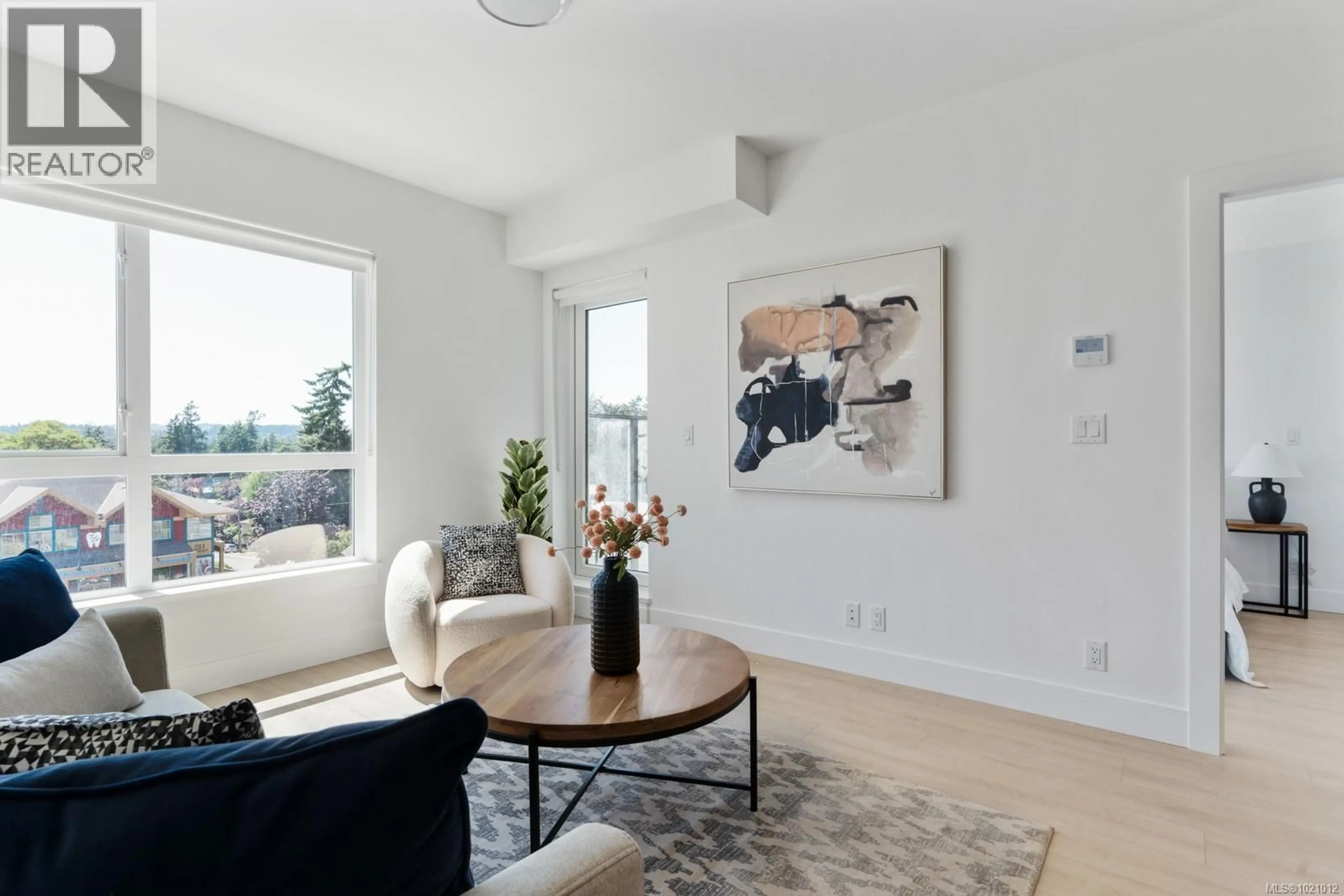 Living room with furniture, unknown for 606 - 258 HELMCKEN ROAD, View Royal British Columbia X0X0X0