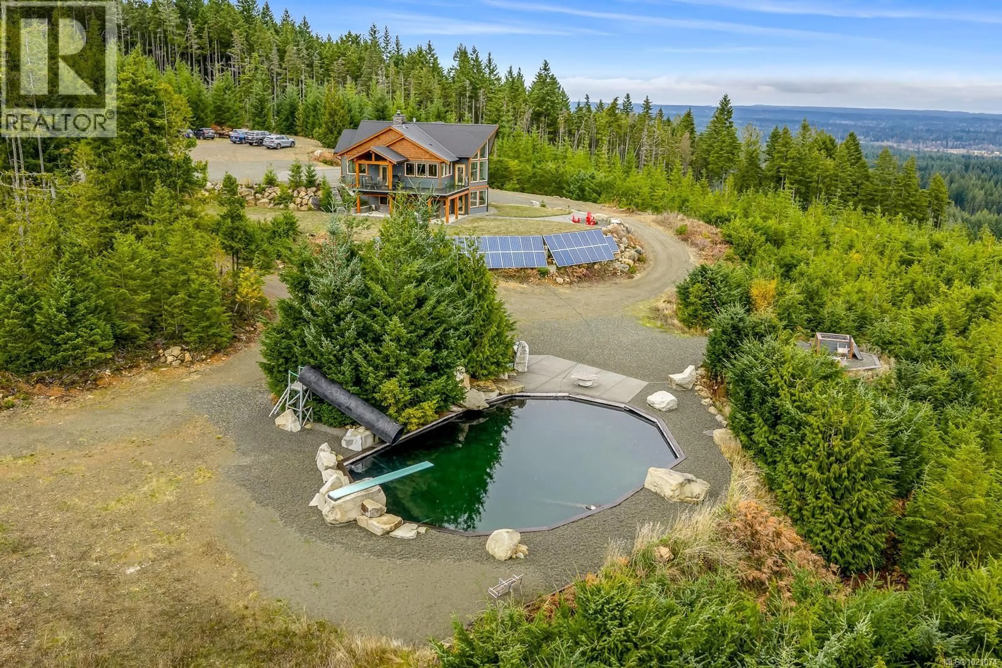 A pic from outside/outdoor area/front of a property/back of a property/a pic from drone, water/lake/river/ocean view for 4777 MYSTIC COVE, Courtenay British Columbia V9J1L3