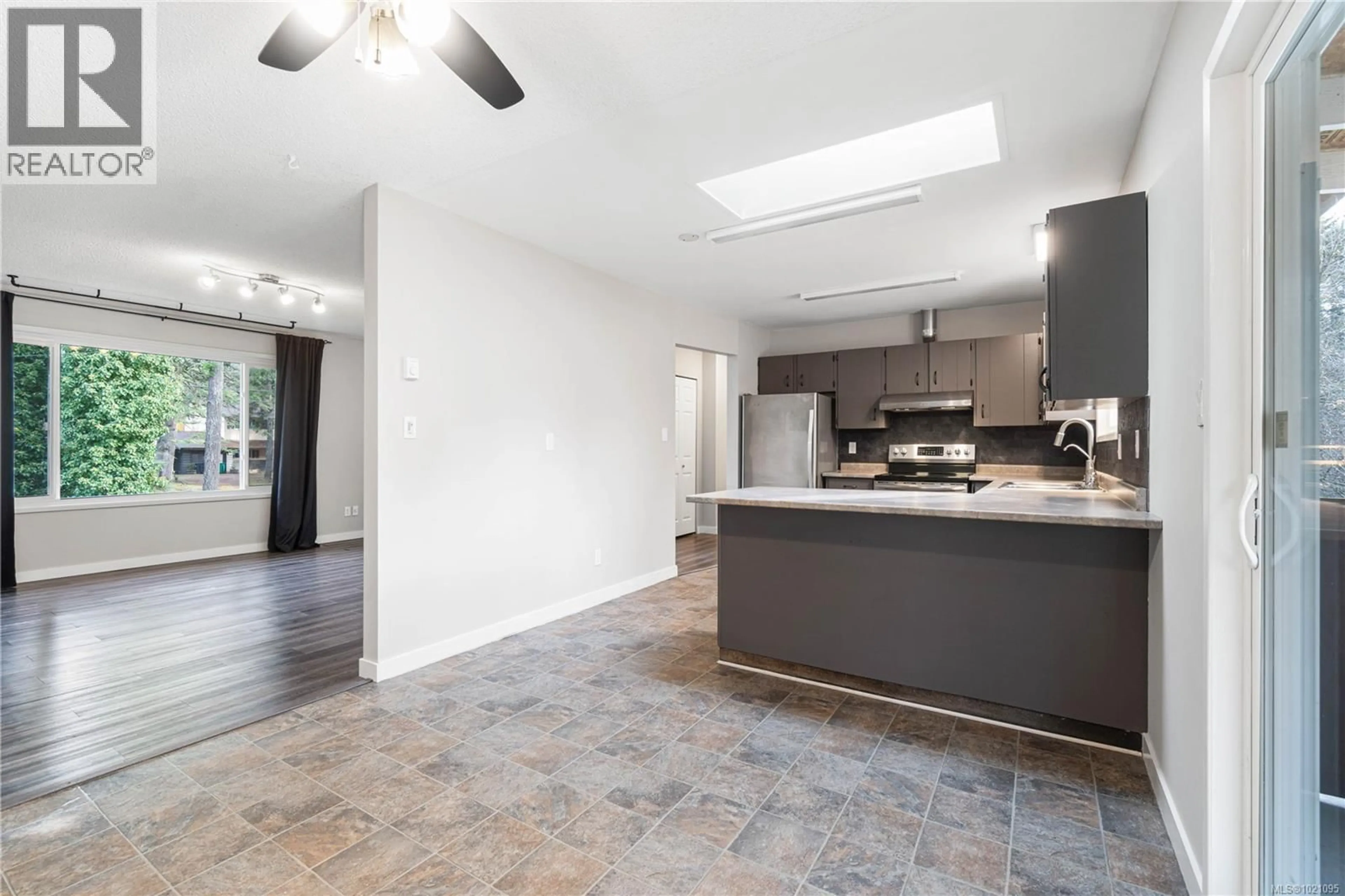 Open concept kitchen, ceramic/tile floor for 2675 LABIEUX ROAD, Nanaimo British Columbia V9T3N3