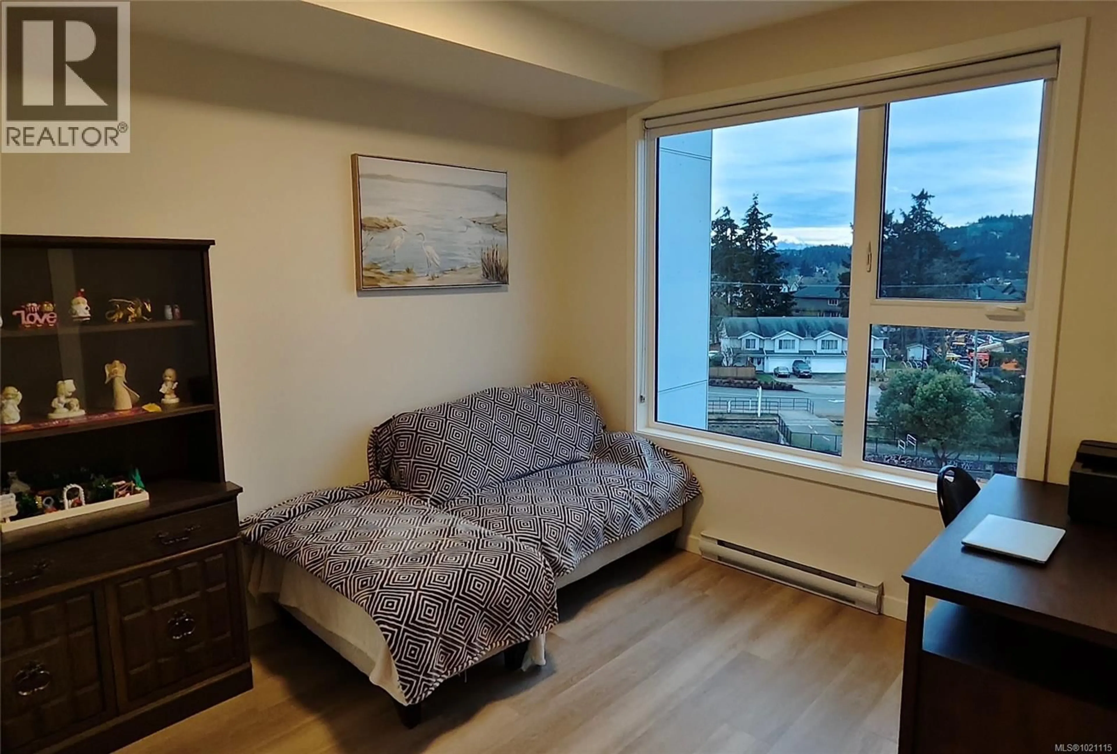 Living room with furniture, wood/laminate floor for 502 - 815 ORONO AVENUE, Langford British Columbia V9B2T9