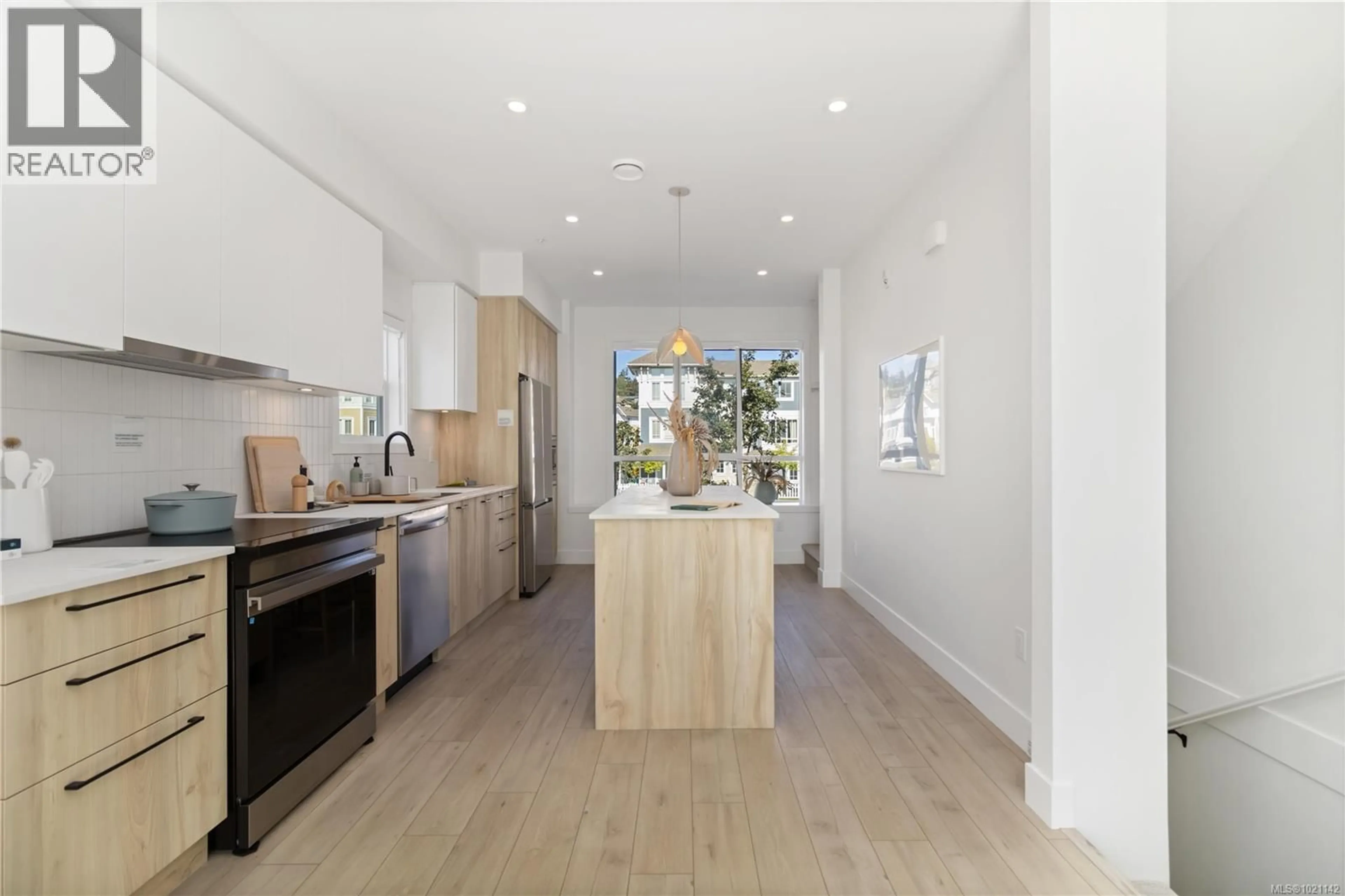 Open concept kitchen, wood/laminate floor for 69 - 368 TRADEWINDS AVENUE, Colwood British Columbia V9C0S5