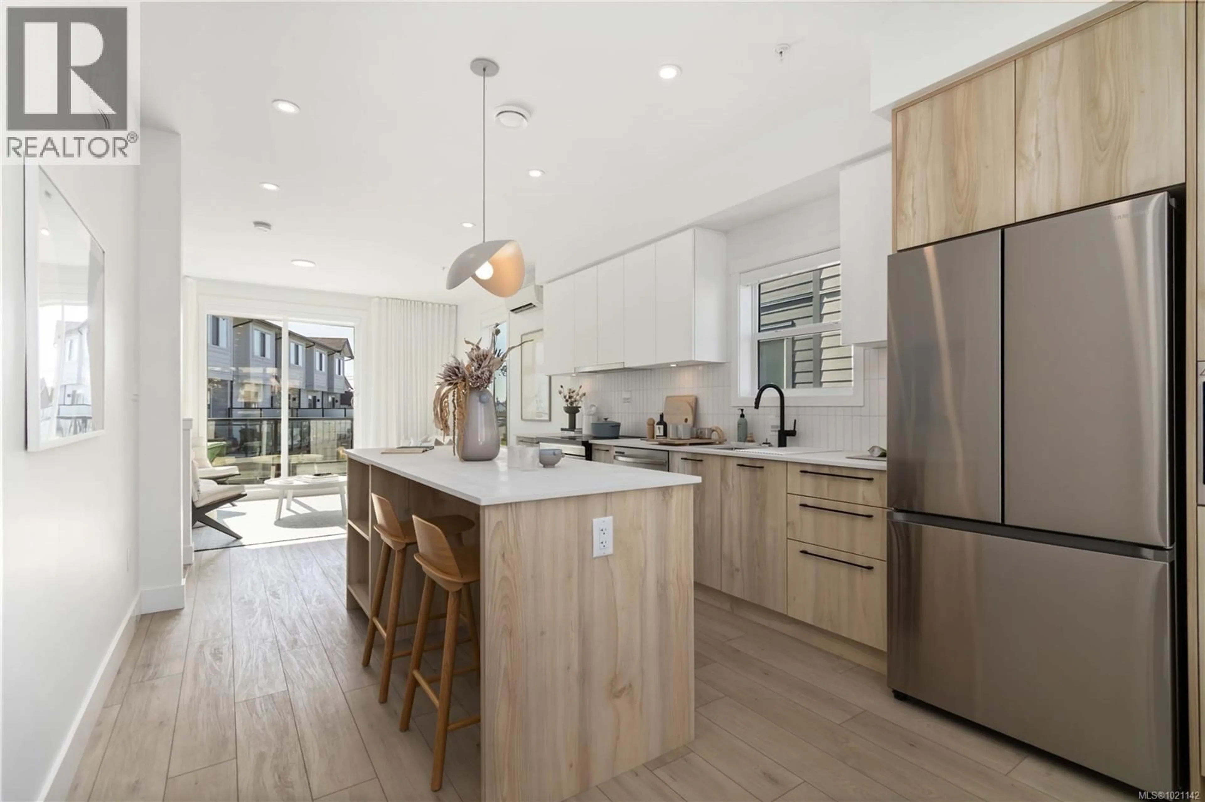 Open concept kitchen, wood/laminate floor for 69 - 368 TRADEWINDS AVENUE, Colwood British Columbia V9C0S5