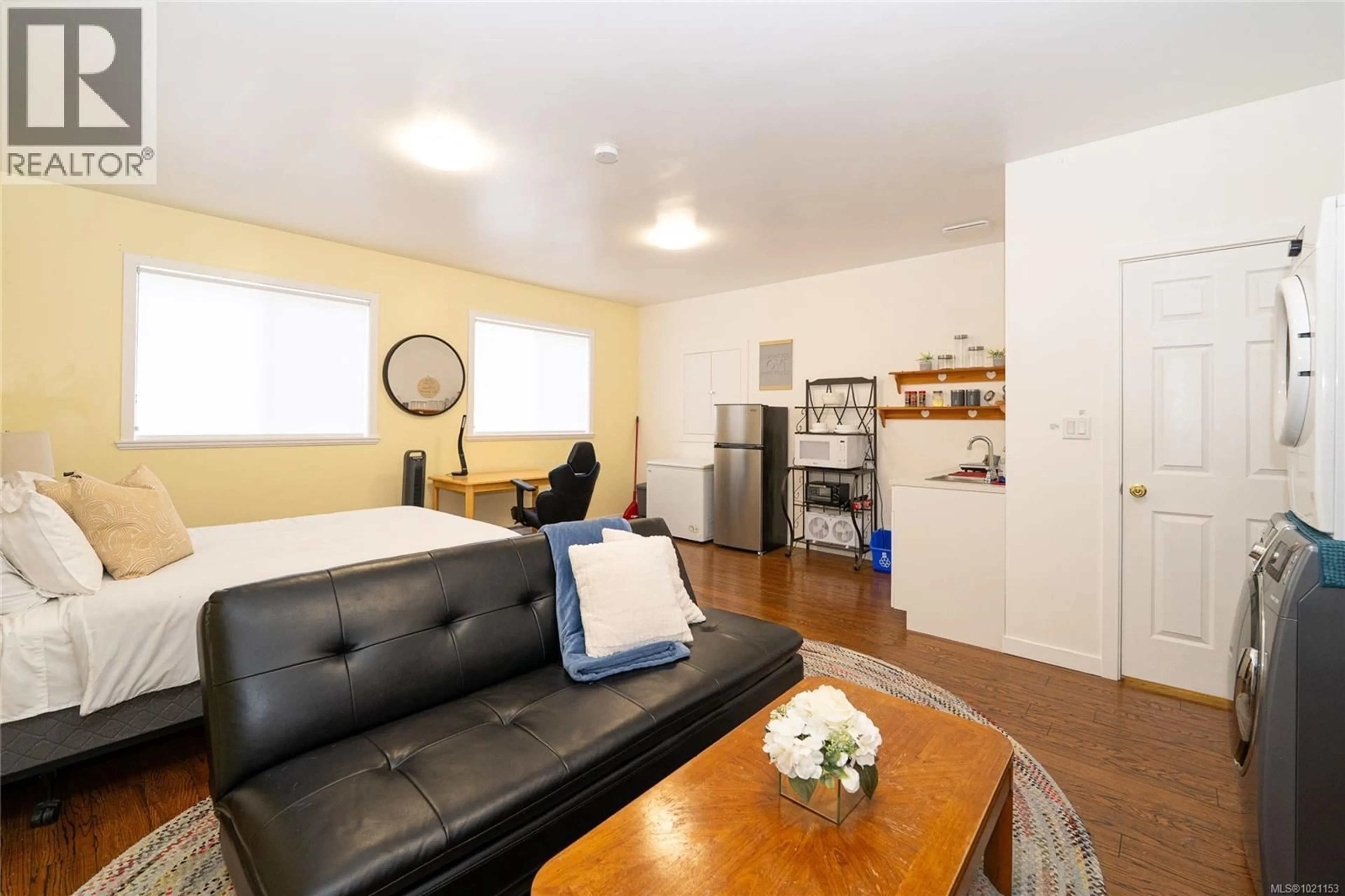 Living room with furniture, wood/laminate floor for 2236 TARA PLACE, Sooke British Columbia V9Z0H6