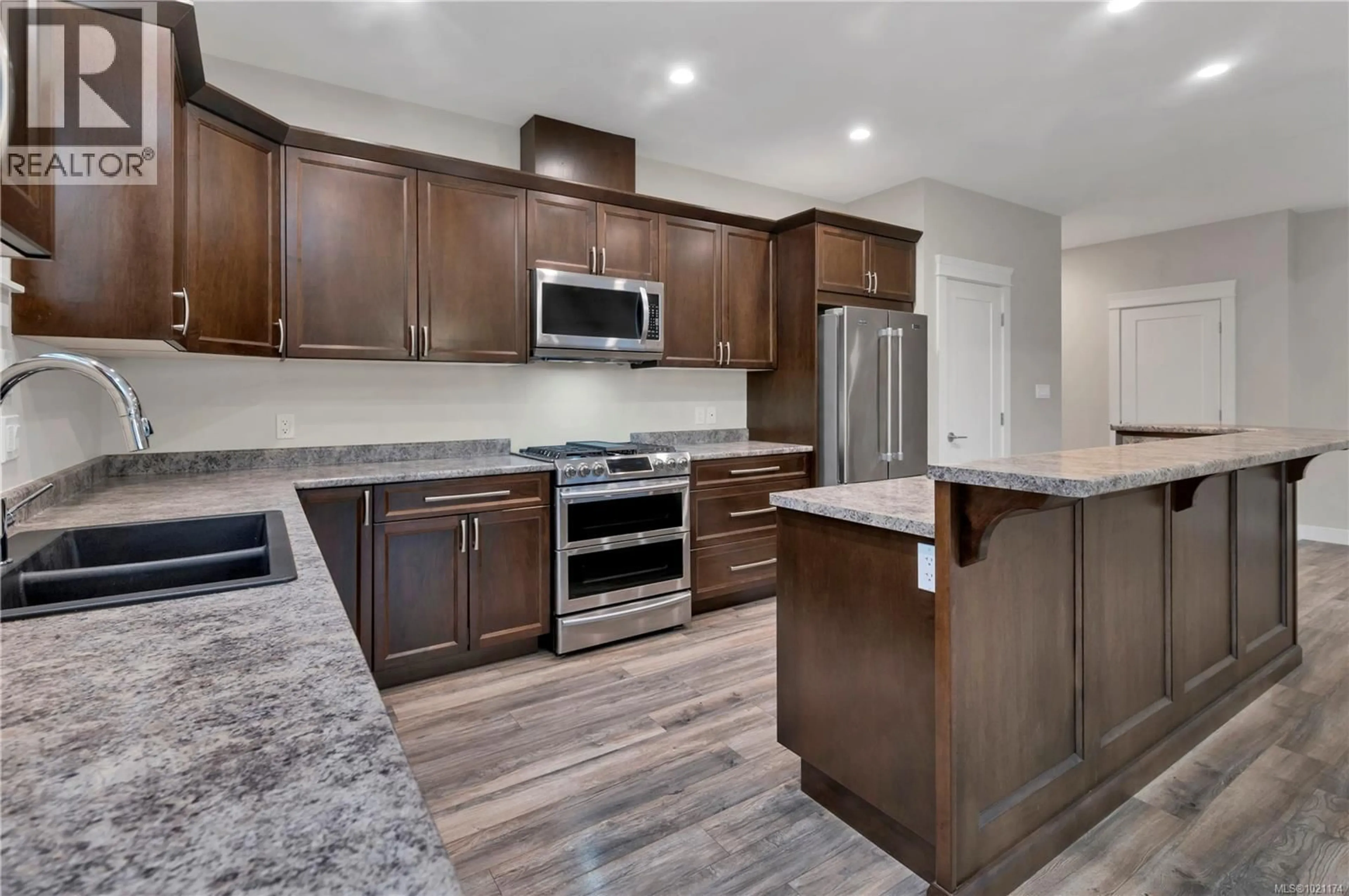 Open concept kitchen, ceramic/tile floor for 477 LEGACY DRIVE, Campbell River British Columbia V9W0A8
