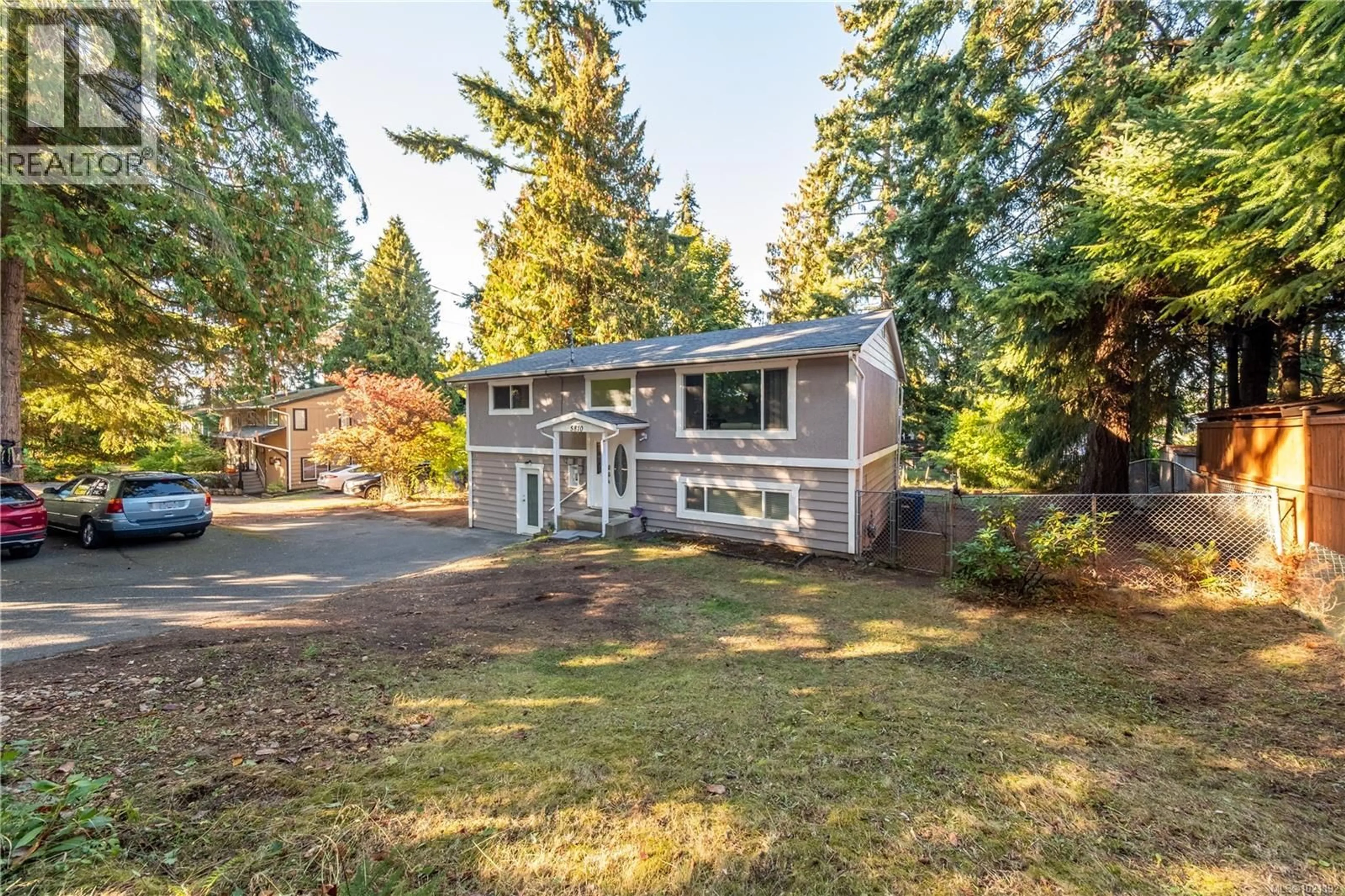 Home with vinyl exterior material, street for 5810 HAMMOND BAY ROAD, Nanaimo British Columbia V9T5N3