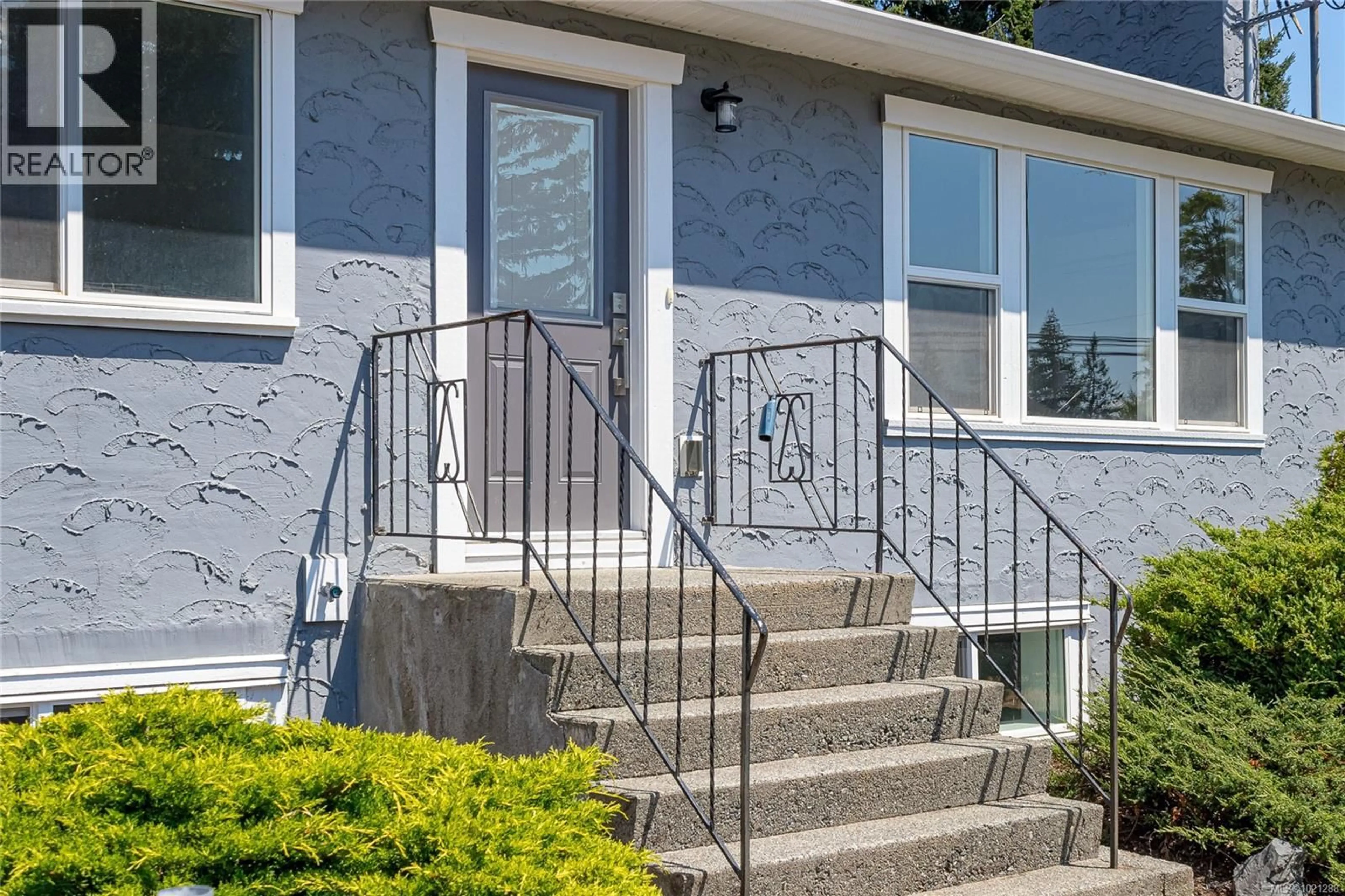 Home with vinyl exterior material, street for 5350 METRAL DRIVE, Nanaimo British Columbia V9T2K8