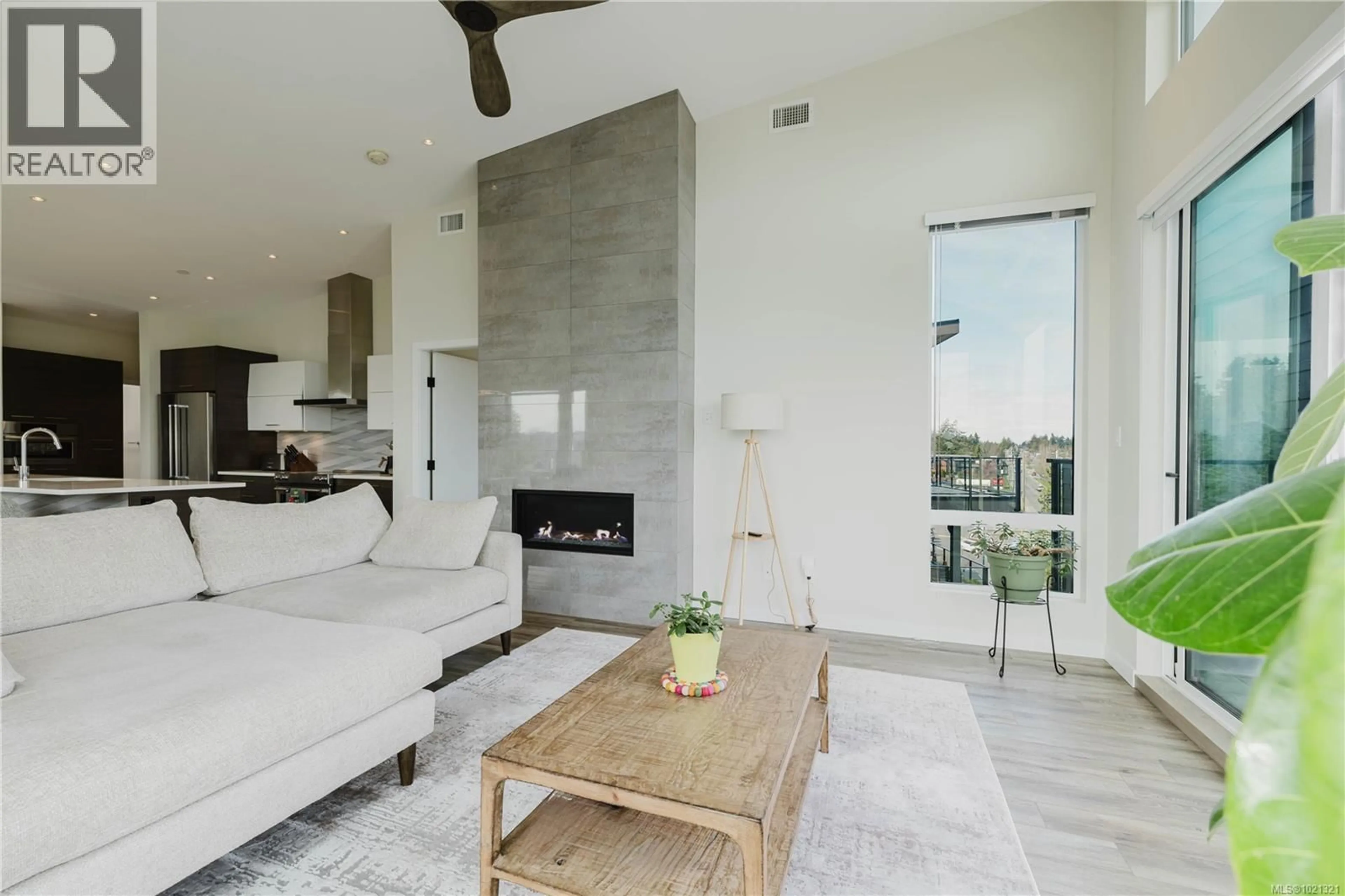 Living room with furniture, ceramic/tile floor for 402 - 100 LOMBARDY STREET, Parksville British Columbia V9P1P3