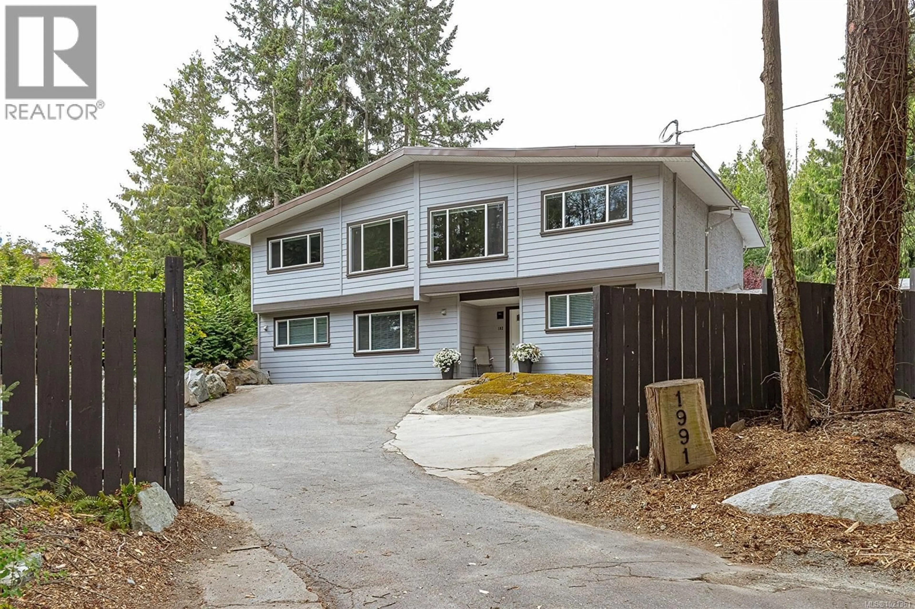 Home with vinyl exterior material, street for 1991 DEAN PARK ROAD, North Saanich British Columbia V8L1C2