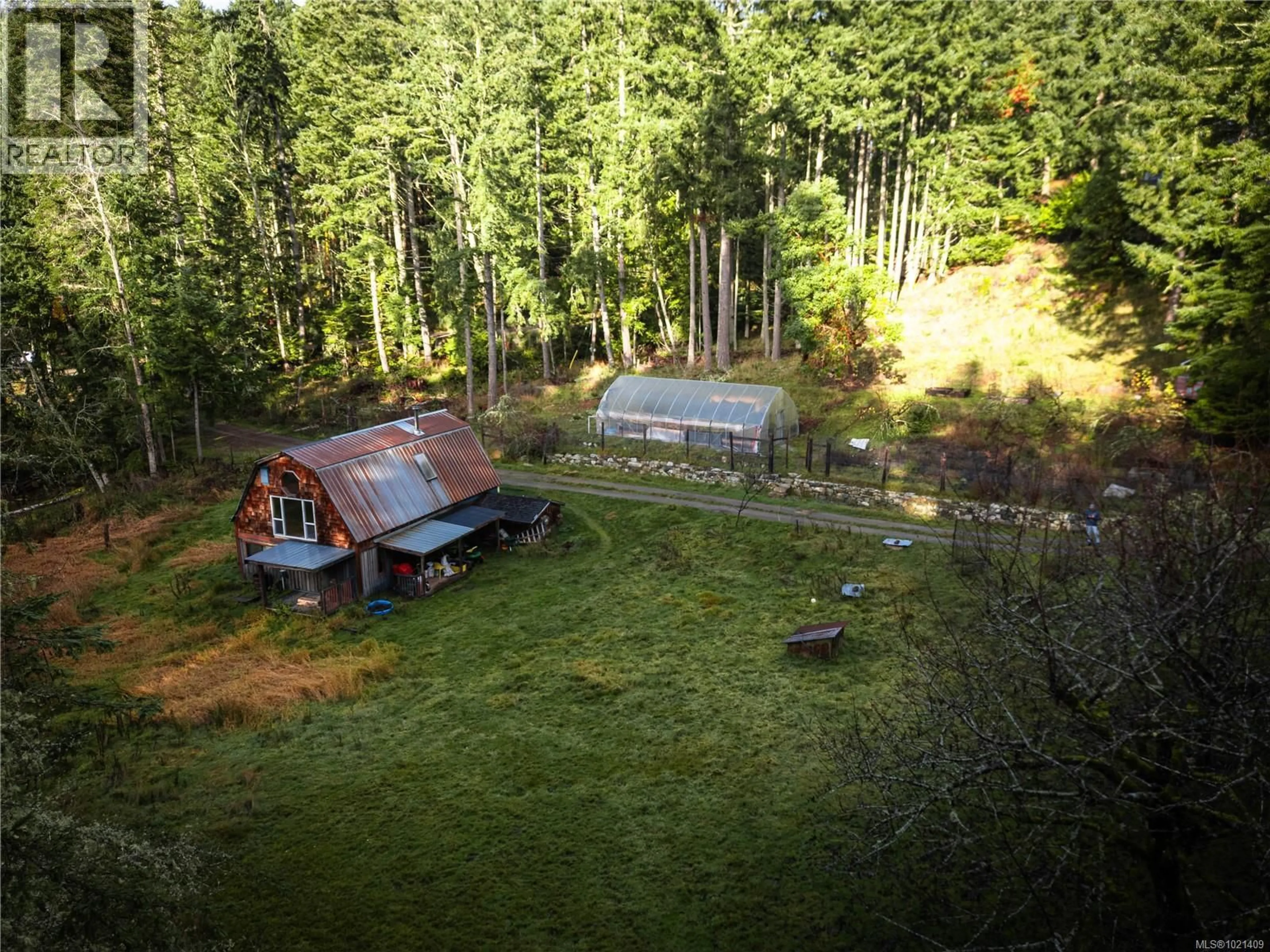 A pic from outside/outdoor area/front of a property/back of a property/a pic from drone, forest/trees view for 185 BULMAN ROAD, Salt Spring British Columbia V8K1X5