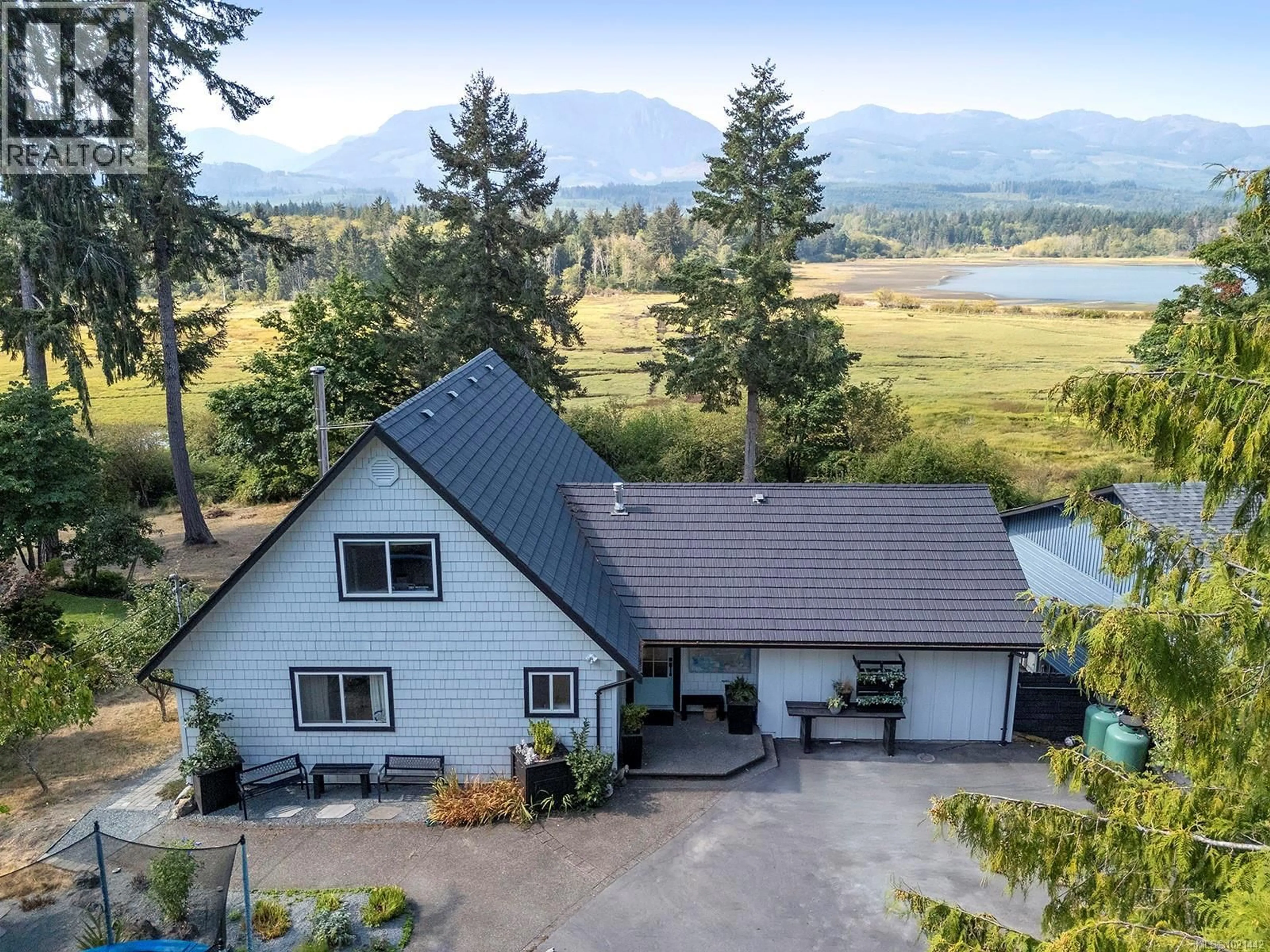 A pic from outside/outdoor area/front of a property/back of a property/a pic from drone, mountain view for 7703 TOZER ROAD, Fanny Bay British Columbia V0R1W0