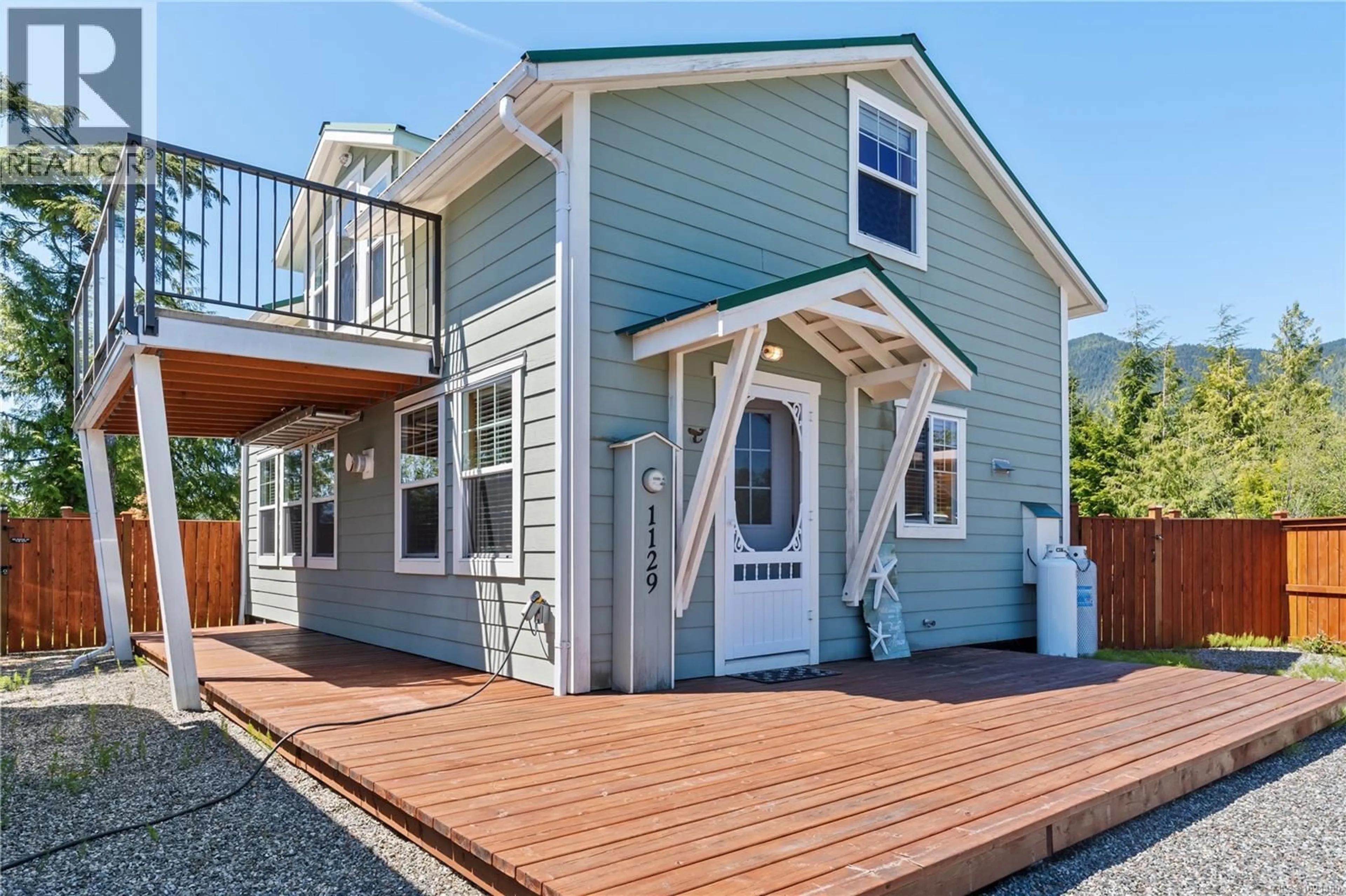 Home with vinyl exterior material, street for 1129 FIFTH AVENUE, Ucluelet British Columbia V0R3A0